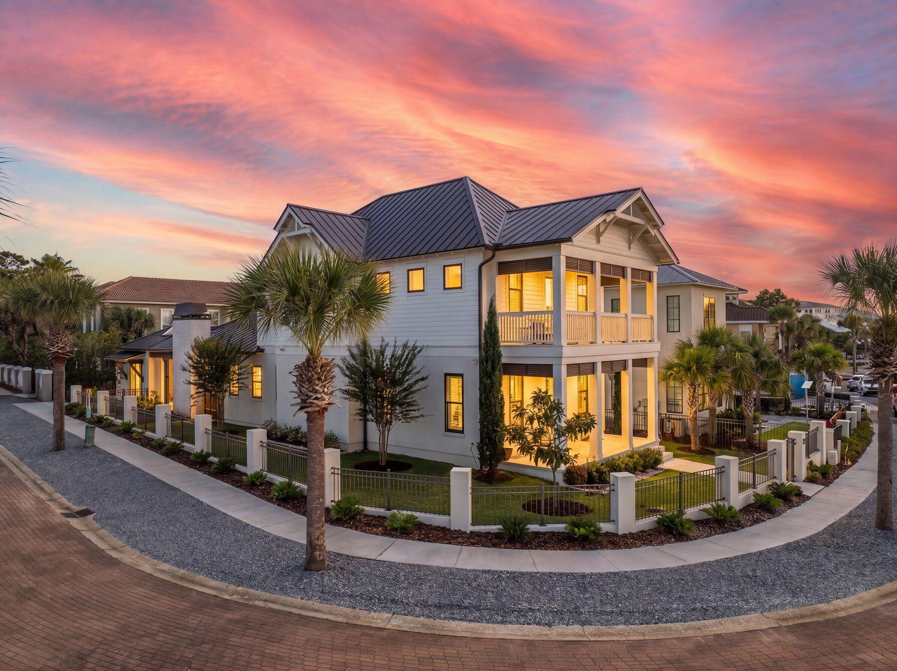 Welcome to 113 White Cliffs Drive, a stunning 2023-built coastal retreat in the sought-after Village of White Cliffs, a gated, Gulf-front community along Scenic Highway 30A in Blue Mountain Beach offering four bedrooms and a dedicated office. Designed with uncompromising attention to detail, this home blends timeless quality craftsmanship with modern convenience, offering both luxury and livability. Sitting on a large corner lot with a fully fenced yard--constructed of block and aluminum for durability--it's perfect for letting pets roam freely. The oversized one-car garage with coated floors adds function, while the screened-in porch with a brick gas fireplace creates a cozy gathering space year-round. Inside, thoughtful design is evident throughout. A welcoming two-story foyer leads to an open and flowing layout where the living, dining, and kitchen spaces connect seamlessly. The living room showcases beamed ceilings, while the gourmet kitchen impresses with a large center island, Quartz countertops, Thermador appliances including a gas range and oven, an additional Samsung dual-temperature built-in oven, convection microwave, wine refrigerator, trash compactor, and custom cabinetry with custom organization solutions. A large pantry provides even more storage. Conveniently located on the first level, the luxurious primary suite boasts vaulted pine ceilings, screened porch access, dual closets, and a spa-inspired en suite with quartzite counters, dual vanity, crystal hardware, and a wet room complete with a jetted tub surrounded by quartzite and a walk-in shower. The first level also includes a mud room with an ice maker and additional storage, a laundry room with sink and cabinetry, a powder bath with quartzite countertops, and a private office featuring custom storage and custom glass barn doors. Upstairs, three guest bedrooms provide comfort and privacy. A private suite offers dual vanities and a tub and shower combo, while the two additional guest rooms share a Jack-and-Jill bathroom. The versatile fourth bedroom with wet bar and balcony creates flexibility to be utilized as a den or additional sleeping space. Additional highlights include engineered hardwood and tile throughout, spacious attic storage with heavy-duty aluminum stairs, and advanced features such as smart home capabilities, Cat6 wiring, a Rinnai tankless water heater, irrigation system, and Live Oak Fiber internet. Beyond the home, residents of The Village of White Cliffs enjoy exceptional amenities including a private beach walkover with convenient bathrooms and a viewing deck, clubhouse with full kitchen and gathering spaces, a newly renovated fitness center, seasonally heated pool, and tennis courts with pickleball lines and lights. This exclusive, short-term rental-restricted community ensures a peaceful coastal lifestyle just moments from the best of 30A. 113 White Cliffs Drive is more than a home it's a statement of quality, comfort, and refined coastal living.