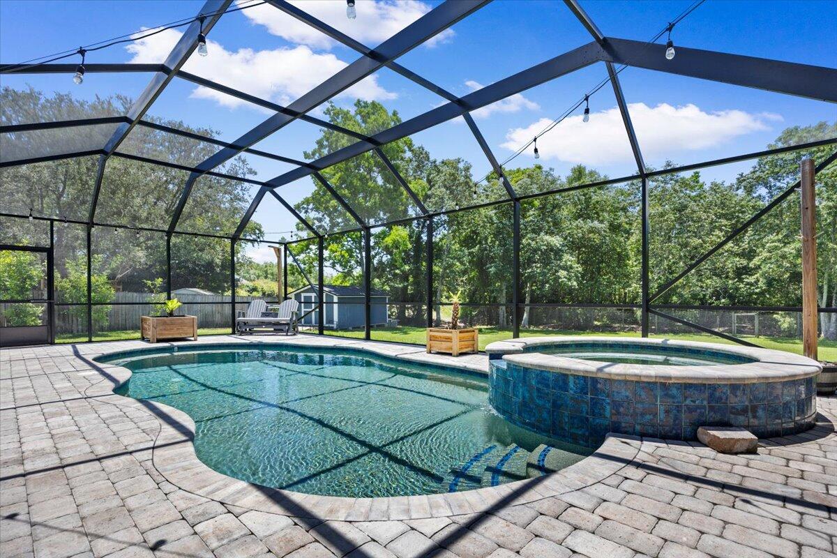 This home lives larger than expected and delivers the Florida lifestyle buyers dream about! In addition to 1,823 square feet, this home also features a year-round 12' x 15' Florida room with its own mini split, creating valuable flexible space for relaxing, entertaining, working from home, or enjoying peaceful views of the backyard.
Step outside and you'll find the true showstopper -- an incredible outdoor oasis designed for everyday enjoyment and unforgettable entertaining. Situated on a generous .36-acre lot with a fenced-in yard, this backyard offers room to spread out and enjoy it all. The PebbleTec finish gas heated pool with hot tub spa area, covered lanai, expansive paver patio, and custom paver gas firepit create the perfect setting for pool days, cozy evenings, and gatherings with family and friends. There's also a large 11' x 18' shed for extra storage and even a treehouse for kids, grandkids, or visiting company to enjoy!
Inside, the kitchen offers beautiful quartz countertops with backsplash, a butcher block island, and stainless steel appliances, blending warmth, function, and style. The bathrooms have also been thoughtfully updated with beautiful vanities and countertops, giving the home a fresh, elevated feel throughout. The garage even has its own mini split, adding comfort and flexibility for hobbies, storage, a workshop, or gym space.
For added peace of mind, the seller has a clear 4-point inspection completed 10/2025 that can be provided.This one wont last! With inviting indoor spaces, bonus climate-controlled living areas, and a backyard built for year-round enjoyment, this home is the total package -- comfortable, stylish, and made for Florida living!