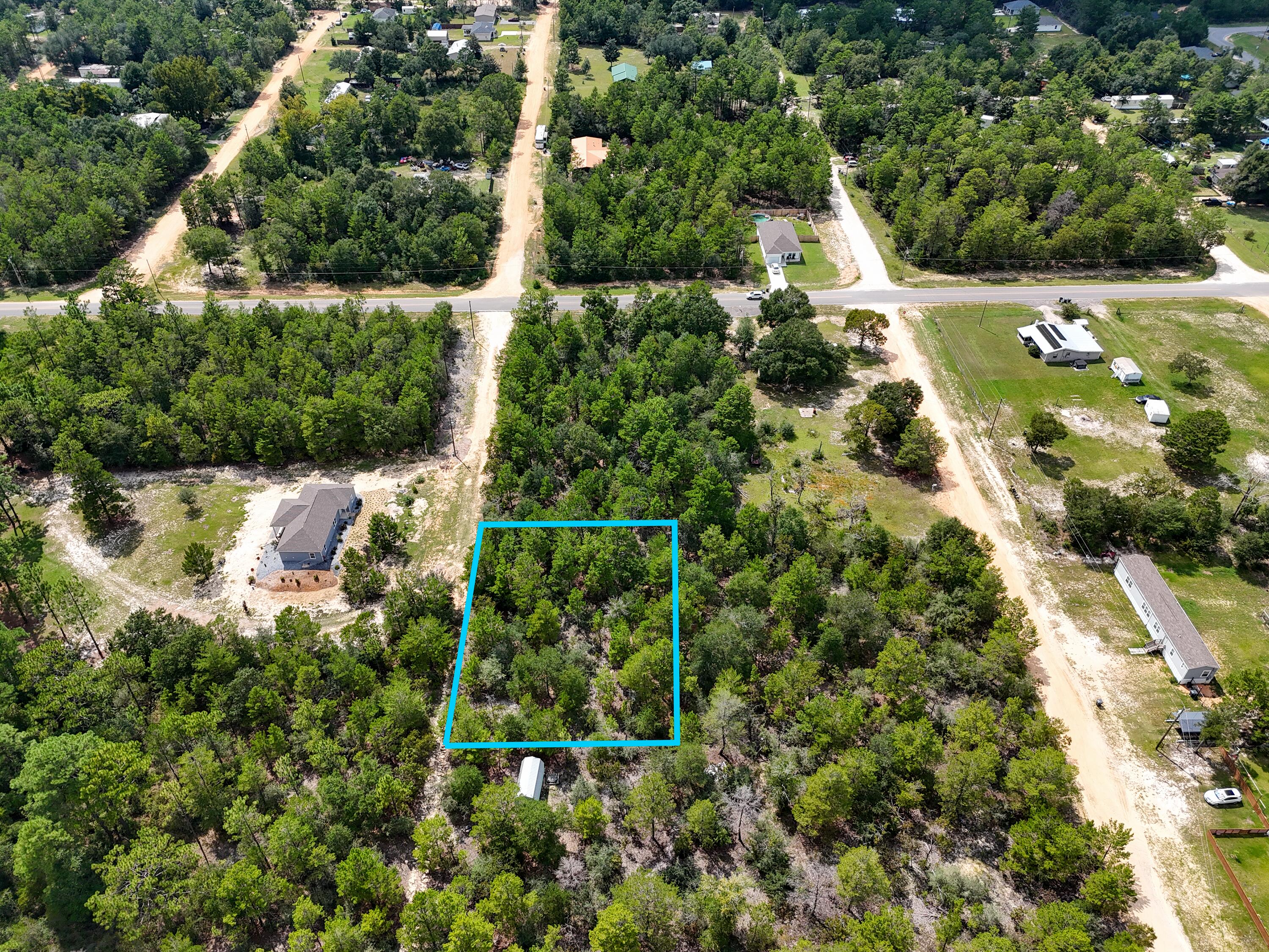 If you have been sitting back watching the market for a deal here it is! Almost a 1/2 of an acre for ONLY $28,700k with an additional lot available. Located just off HWY 90 allows for a easy commute to town and to jobs. Loys at this price do not come along often. Mossy Head water available and Chleco Power just across the street makes getting utilities easy!  Property recently has a septic, but location is unknown on which lot it is on and seller has no knowledge of use capability. Grab this deal today! Lots can be bought separate for $14,900 a piece.