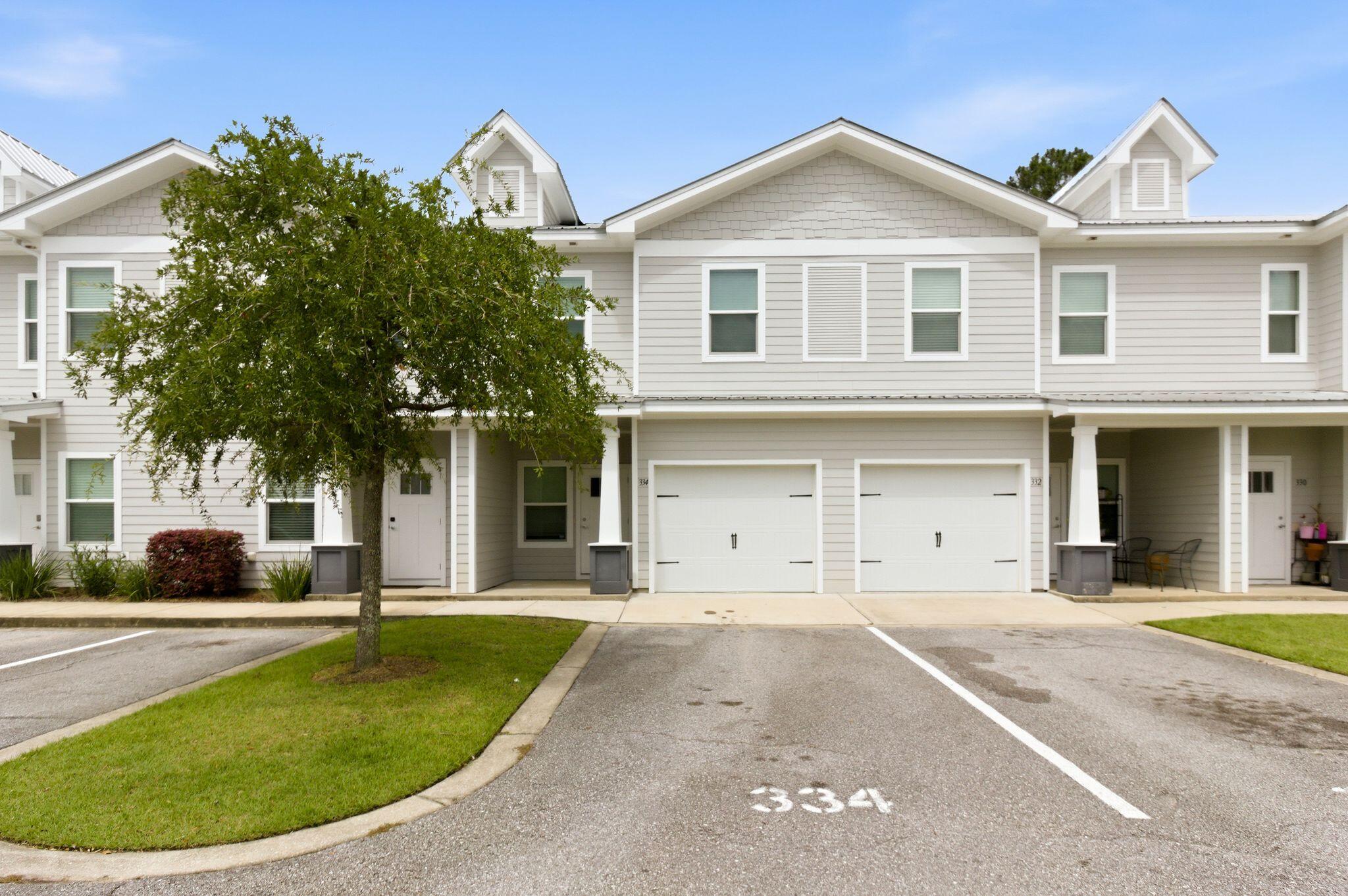 ALL NEW PAINT! Welcome to 334 N Sand Palm Rd in the sought-after Verandas at Freeport community -- a beautifully designed 3-bedroom, 2.5-bath townhome offering the perfect blend of comfort, style, and convenience. Built in 2021, this two-story home features approximately 1,432 sq ft of living space with an open-concept layout, spacious bedrooms, and a one-car garage. The bright and inviting main living area flows seamlessly into the kitchen, complete with quartz countertops, stainless steel appliances, including new dishwasher, luxury vinyl plank flooring, and modern finishes throughout. Upstairs, you'll find a generous primary suite with a walk-in closet and private bath, along with two additional bedrooms and a full guest bath. Out the back door there is a spacious screeened in patio.  Located just minutes from Freeport schools, shopping, dining, and a short drive to the white-sand beaches of the Emerald Coast, this home offers low-maintenance living in a growing community with neighborhood amenities including a community pool and sidewalks. Whether you're looking for a primary residence, investment property, or coastal retreat, this move-in-ready townhome is an opportunity you won't want to miss.