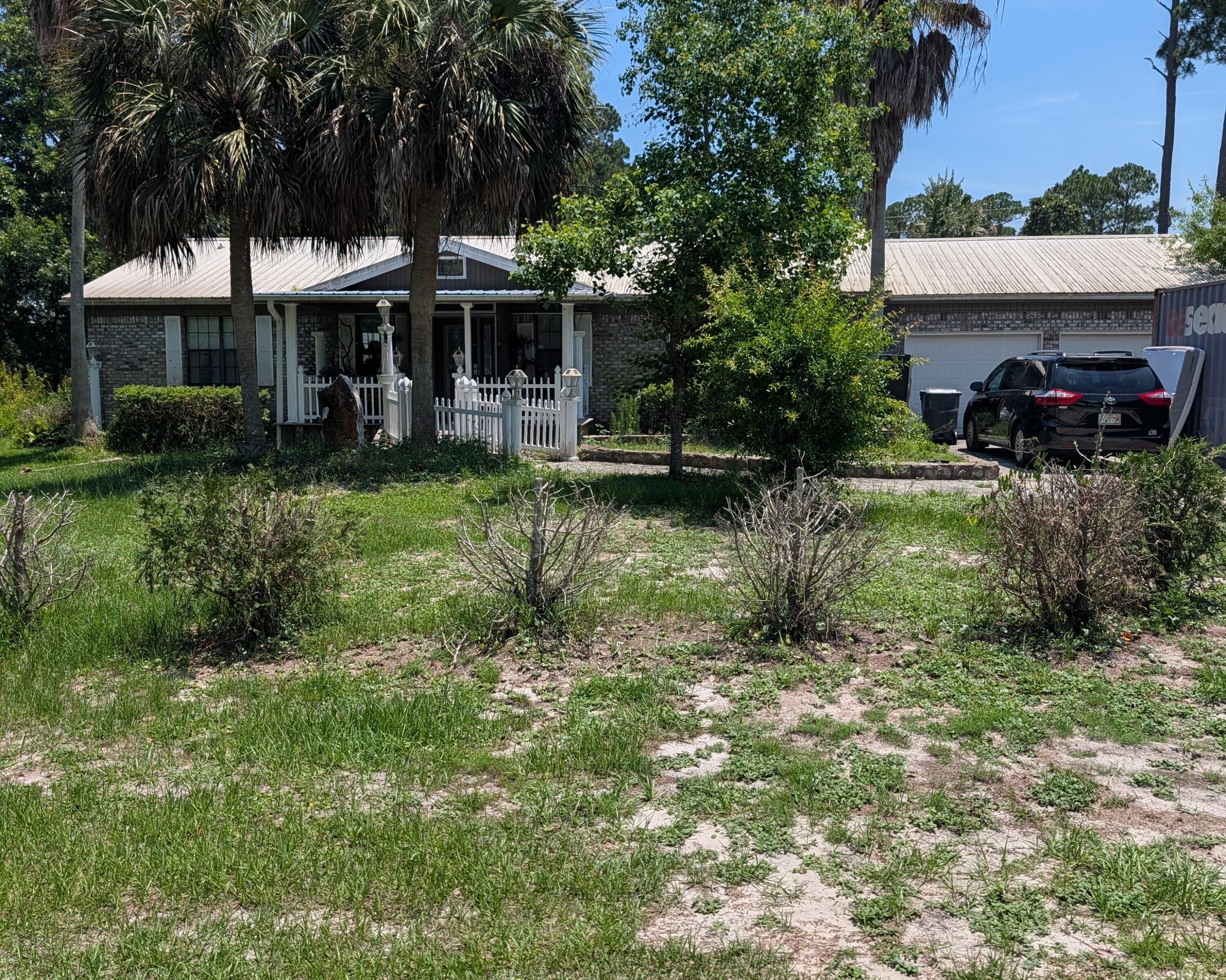 Two private lots with a total of .831 acres. Ranch Style brick home, small pool, attached 2 car garage and close to the beach.  Zoned Residential Preservation per the county. Short term rentals allowed.