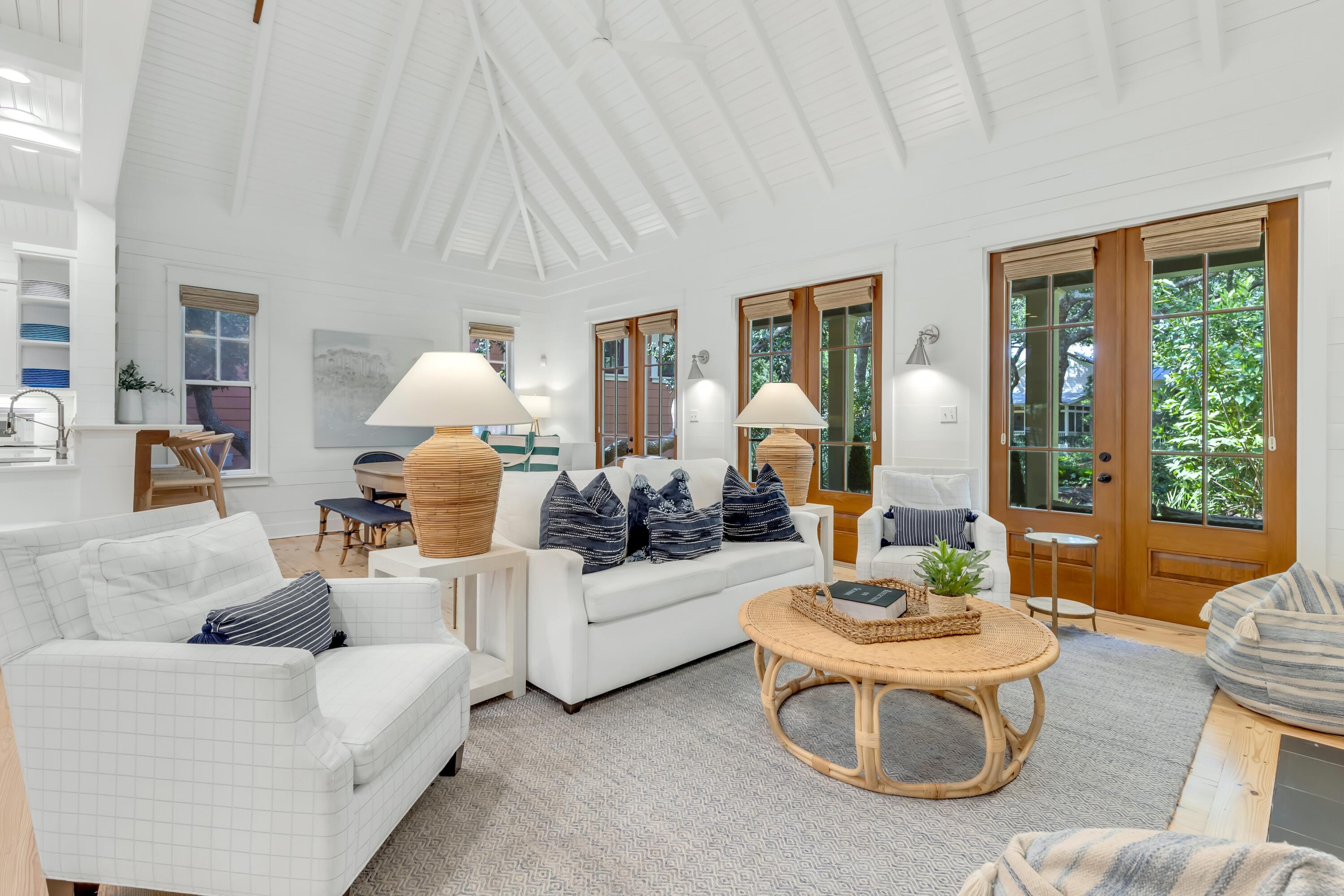 Perfectly positioned between Western Lake and the Gulf. 114 Sunset Ridge Lane offers an exceptional location in WaterColor's highly sought-after Phase I Park District. Enjoy an easy stroll or golf cart ride to the WaterColor Beach Club, the beach, the Boathouse, and the shops and restaurants of WaterColor and neighboring Seaside.

Overlooking picturesque Crimson Park and the Rose Garden Mews, this beautifully curated coastal cottage features more than 1,700 square feet with two bedrooms, a bunk room, and two-and-a-half baths. Serena & Lily furnishings complement the home's relaxed yet refined design, while soaring cathedral and beamed ceilings, oversized windows, and multiple French doors fill the interiors with natural light. The first-floor primary suite includes a spacious ensuite bath and direct access to a private screened porch. Upstairs, a generous loft with two queen beds provides comfortable accommodations for family and guests.

Offered fully furnished with a six-seat golf cart, this turnkey retreat includes access to WaterColor's outstanding amenities, including multiple pools, tennis and pickleball courts, a fitness center, scenic trails, and paddleboarding and kayaking on Western Lake. With its prime location, flexible sleeping arrangements, and strong rental potential, this is a rare opportunity to enjoy the best of the WaterColor lifestyle.