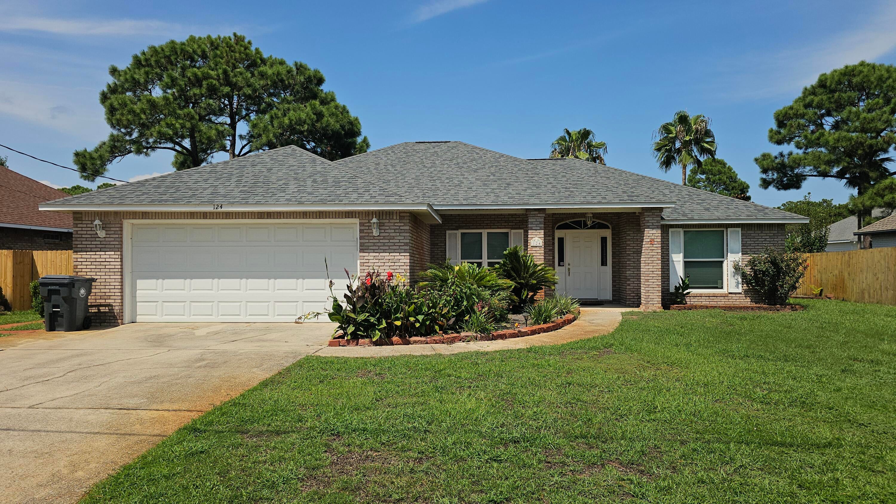 Welcome to 124 Pritchard Rd in Miramar Beach, Florida, a well-maintained 3-bedroom, 2-bath single-family home offering approximately 1,699 square feet of living space, a 2-car garage, fenced backyard, fireplace, and desirable split-bedroom floor plan. The spacious main living area features a vaulted ceiling, fireplace, abundant natural light, and hard-surface flooring, creating an open and comfortable space for everyday living. The split-bedroom design provides separation between the primary bedroom and additional bedrooms.
The kitchen offers generous cabinet and counter space with an adjoining dining area. The home also provides a dedicated laundry area and additional storage. Outside, the fenced backyard provides usable private outdoor space, while the attached 2-car garage offers convenient parking and additional storage. Located in Miramar Beach by Choctawhatchee Bay, this home provides convenient access to public bay access, boating and fishing opportunities, as well as the beaches of the Emerald Coast, Destin, Sandestin, shopping, restaurants, entertainment and major area roadways. This 3-bedroom home combines location, space, outdoor living and garage parking in one property. All leases through PMOTP are enrolled in the Resident Benefits Package for $50/mo, including insurance, credit building, air filter delivery, pest control & more. $50 app fee. per adult 18+, $75 leasing fee. per adult 18+, $75 leasing fee.