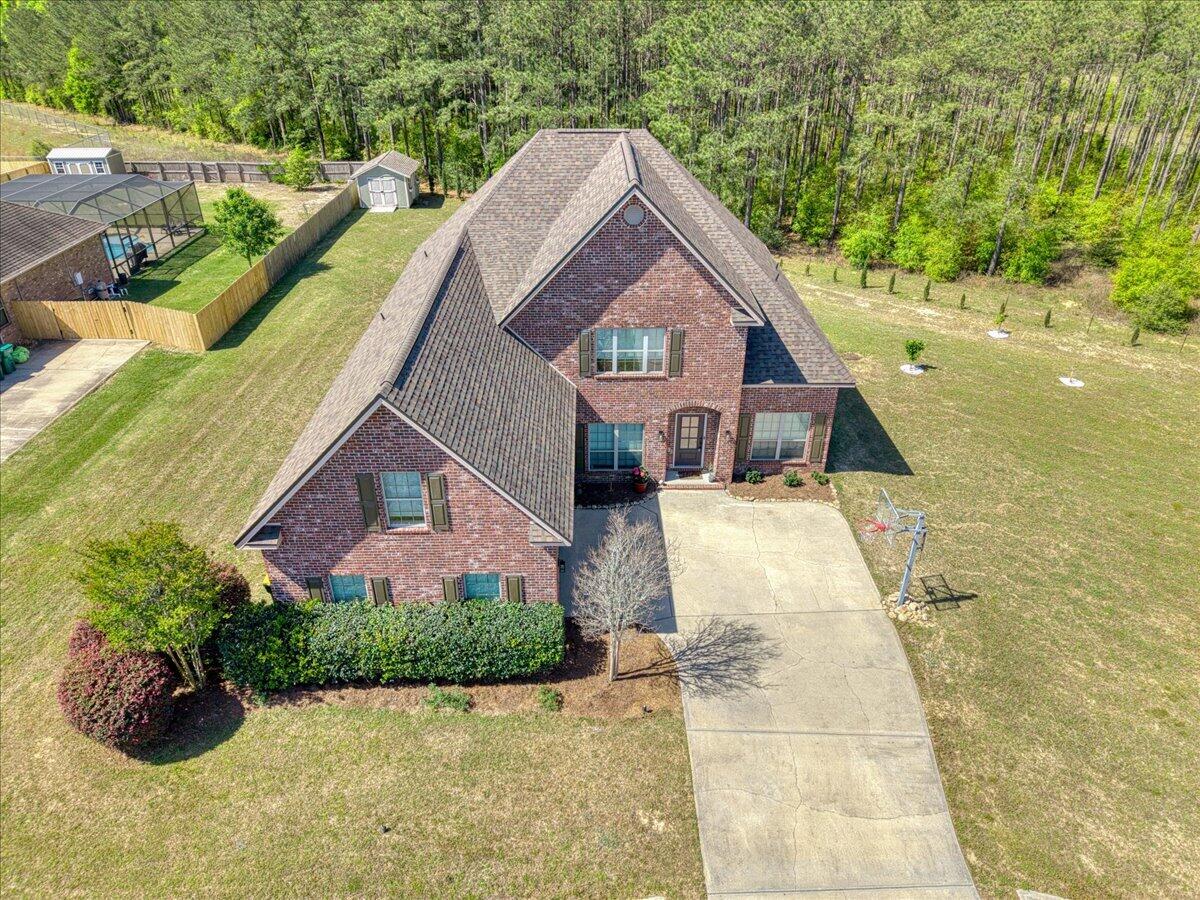 NEW ROOF March 2026, VA APPRAISED FEB 2026 at $485,000. Spacious 5BR/3.5BA traditional-style home in desirable North Crestview on a 0.56-acre lot closest home to Garden City Park, visible from your front door which has new playgrounds! This two-story gem features a formal dining room, office, and media room. Kitchen includes island, stainless appliances, and overlooks the family room with wood-burning fireplace. Rustic wood flooring throughout. Master suite offers trey ceilings, walk-in closet, garden tub, and separate shower. Upstairs: 2BRs, full bath, media room. Enjoy the brick patio with fireplace, mature trees, and built-in basketball hoop. Extras: 2 AC units, 2 walk-in pantries, built-in bench, low HOA ($200/yr), public water, septic, electric, fiber internet
