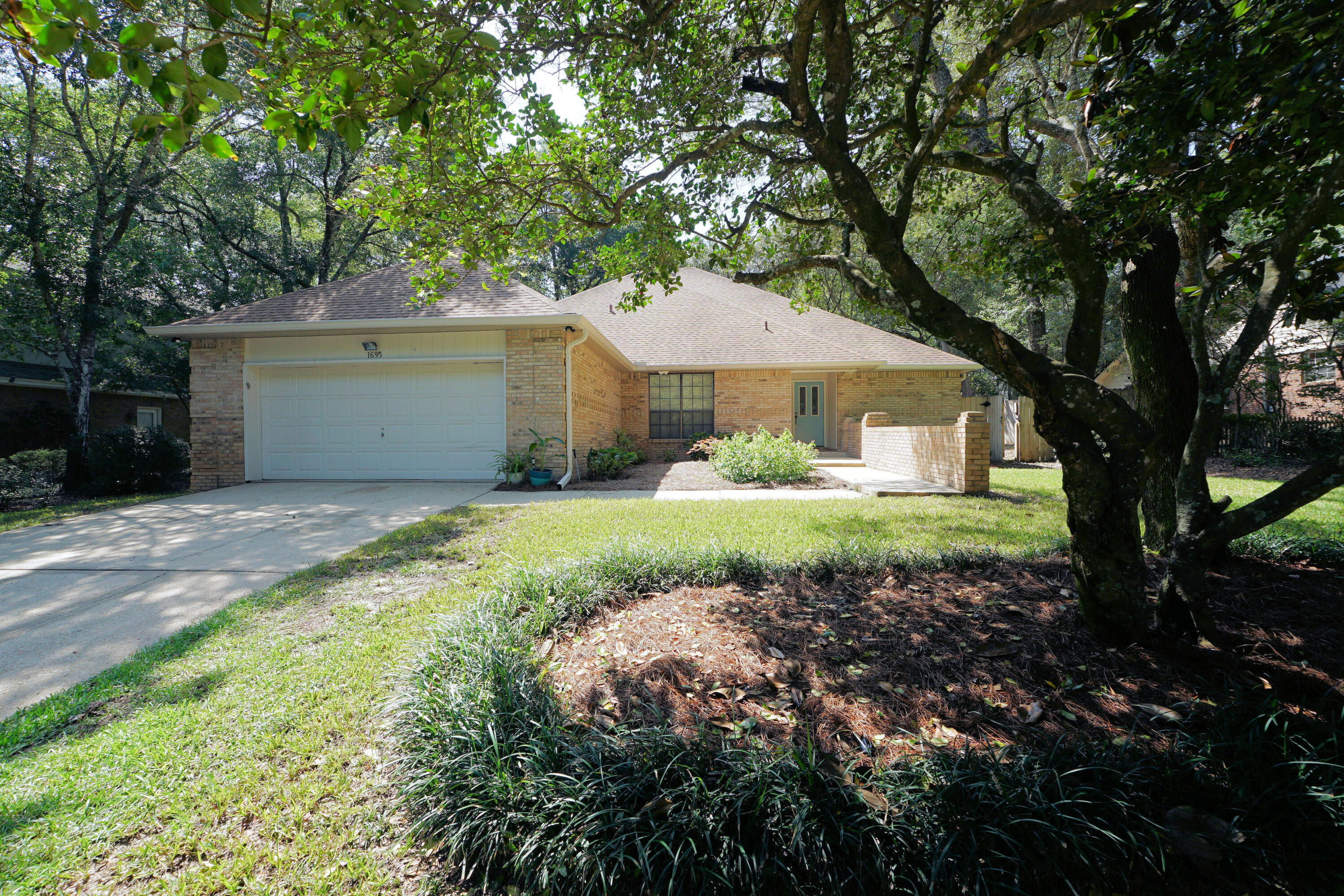 Move-in ready! Experience the epitome of Florida living in this beautifully updated 4-bedroom family home, nestled within the highly desirable gated community of Parkwood Estates in Bluewater Bay. Boasting an unbeatable location, this property is just a 5-minute walk to top-rated Bluewater Elementary and nearby state and federal forest trails.Modern plank tile flooring throughout, the functional floor plan flows effortlessly between the spacious living room, formal dining room, and cozy den. The heart of the home is the stunningly remodeled kitchen by Linn's Prestige Kitchens, complete with premium granite countertops, stainless steel appliances, a built-in convection microwave, a dual-fuel double-oven range, recessed lighting, a custom tile backsplash, and a convenient pass-through breakfast bar designed for seamless entertaining. Designed for maximum versatility, the first-floor hosts both the spacious primary suite and a convenient second bedroom. Exterior highlights include a sturdy hip roof with dimensional shingles (10 years old) and lush, mature landscaping framed by majestic trees. Schedule your tour today!
Bluewater Bay has all the amenities, 3 private pools, Golf, pickleball, tennis a full-service marina, wet slips, hi-dry storage, restaurant with outdoor entertainment, walking trails and so much more!!!