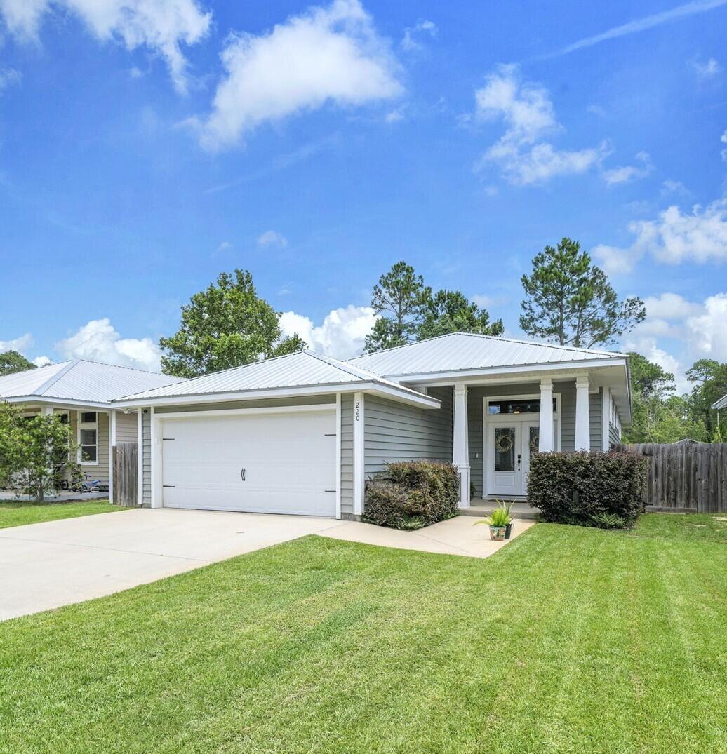 Price Reduced!!  Sellers are also offering a $10,000 Buyer Closing Cost Incentive!! Welcome home to this stunning 3-bedroom, 2-bath residence offering over 1,700 square feet of thoughtfully designed living space with soaring 10-foot ceilings that create an open and inviting atmosphere. The stylish interior features premium luxury vinyl plank flooring throughout, with tile in both bathrooms, and a gorgeous kitchen showcasing granite countertops, butcher block accents, custom pantry barn door, and quality finishes.  The spacious master suite is designed for comfort and features a walk-in closet with custom extra shelving along with a luxurious en-suite bath complete with a large tiled walk-in shower and built-in bench seating.  From the dining area to your private screened-in patio, the perfect place to unwind and relax.  Built with energy efficiency in mind, this home includes a radiant barrier roof system, blown-in insulation and solar panels, helping reduce energy costs while keeping you comfortable year-round. With modern finishes, quality construction, and energy-saving features, this move-in-ready home is one you won't want to miss!  The energy saving solar panels are paid for and ownership will convey with purchase.  NO HOA!