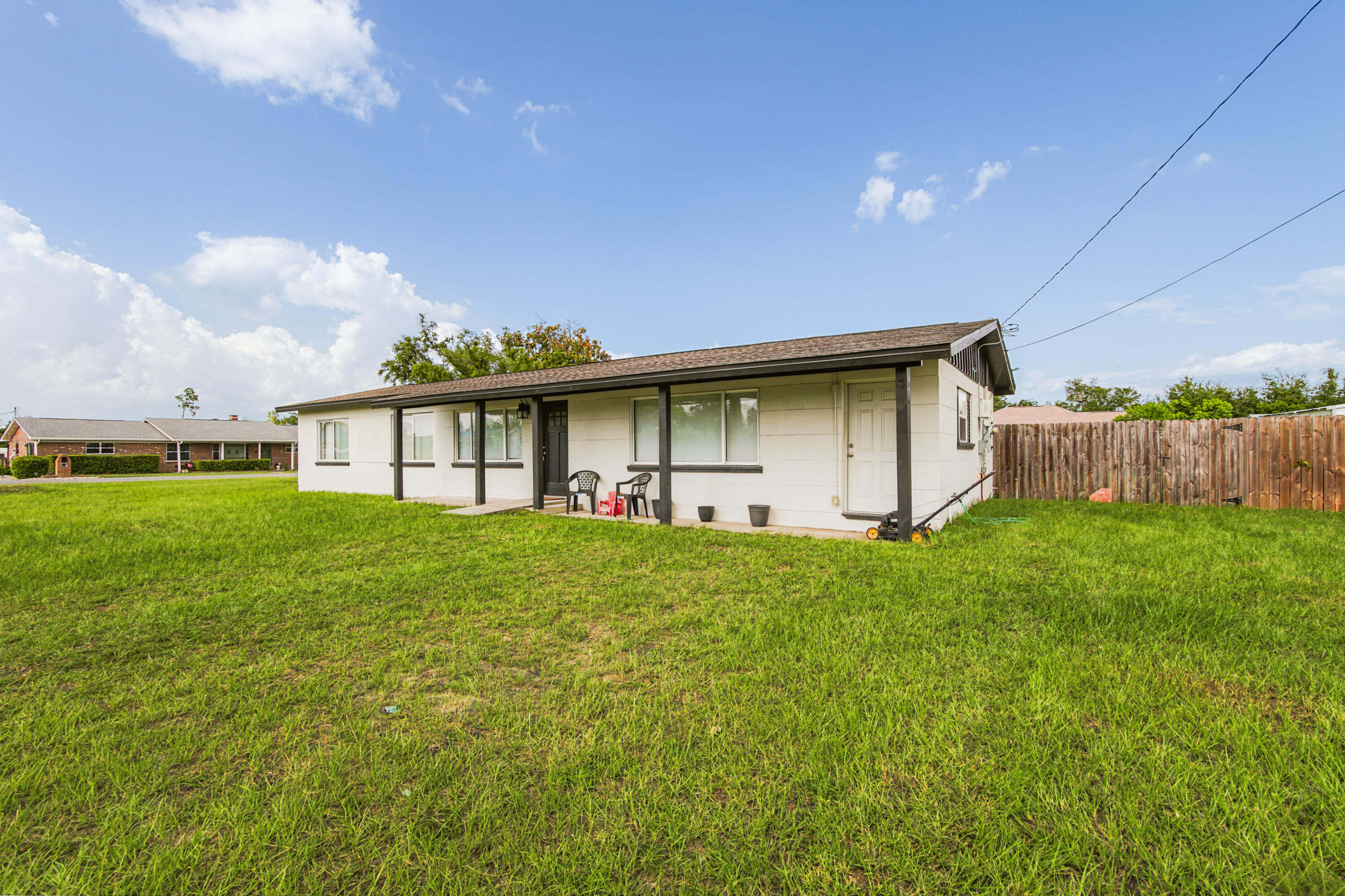 Completely Renovated 4-Bedroom Block Home on a Spacious Corner Lot with Solar Panels & No HOA Welcome to 176 N Anita Drive, a beautifully renovated block home on a slab foundation situated on a generous 0.41-acre corner lot. This move-in-ready property offers 4 bedrooms, 2 bathrooms, modern upgrades throughout, and the freedom of no HOA. Every major system has been updated for peace of mind, including newer plumbing, newer electrical, a newer HVAC system with updated ductwork, luxury vinyl plank flooring throughout, and a tankless hot water heater. The roof was replaced in 2019, adding even more long-term value. The stunning kitchen is designed to impress, featuring: Quartz countertops Large center island with additional workspace and seating LG stainless steel appliance package, including a gas range and InstaView touchscreen refrigerator White shaker-style cabinetry with abundant storage Oversized sink Sleek black glass backsplash Recessed lighting for a bright, modern feel Natural light fills the home, complemented by stylish contemporary light fixtures throughout. A charming barn door leads from the kitchen into the spacious primary suite, which also offers its own private entrance from the front of the home. The primary suite serves as a relaxing retreat with a large walk-in closet and a luxurious ensuite bathroom featuring a custom tile-to-the-ceiling walk-in shower and double vanity. Step outside to a large, fenced backyard offering endless possibilities. With 0.41 acr