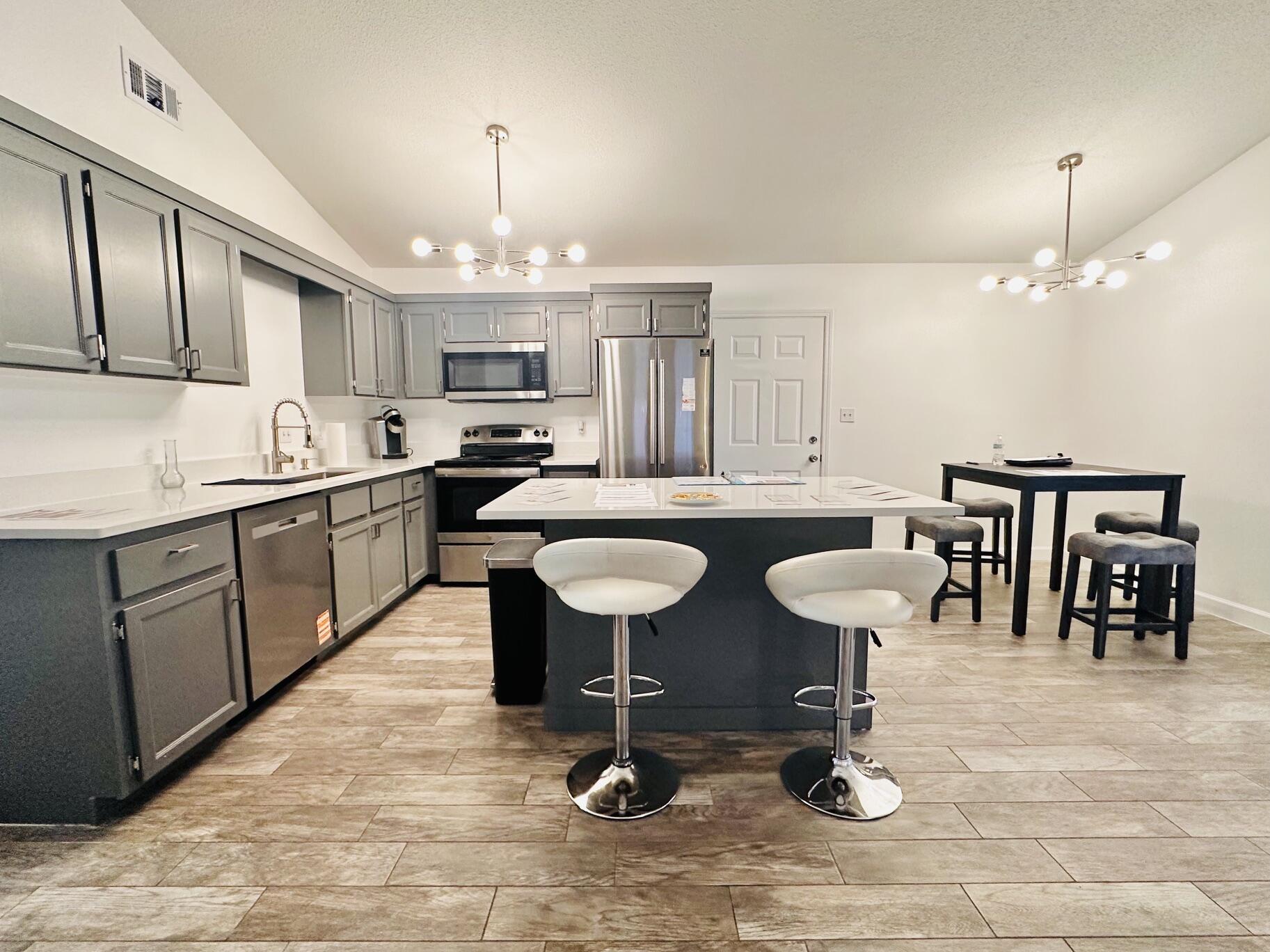 Home 2 BR 2 BA + Garage + Florida Room. Located in the heart of Destin. NO HOA. New Roof 2026, New HVAC 2026, New Water Heater 2026, Copper Wiring, Fresh paint, New sod. Fully Furnished. Kitchen quartz countertops, stainless steel appliances and farm sink. Wood Burning Fireplace. Single Car Garage and laundry room have new epoxy floors. Bright Florida room has tile flooring and fully enclosed. The backyard is fully fenced in for privacy and low maintenance paver hardscaping. You can access Dewey Destin Park from your backyard (tennis courts, basketball, playground). Seller offering 1 year home warranty & yard maintenance. Some photos include virtual staging for illustrative purposes to showcase best use of space and creativity.