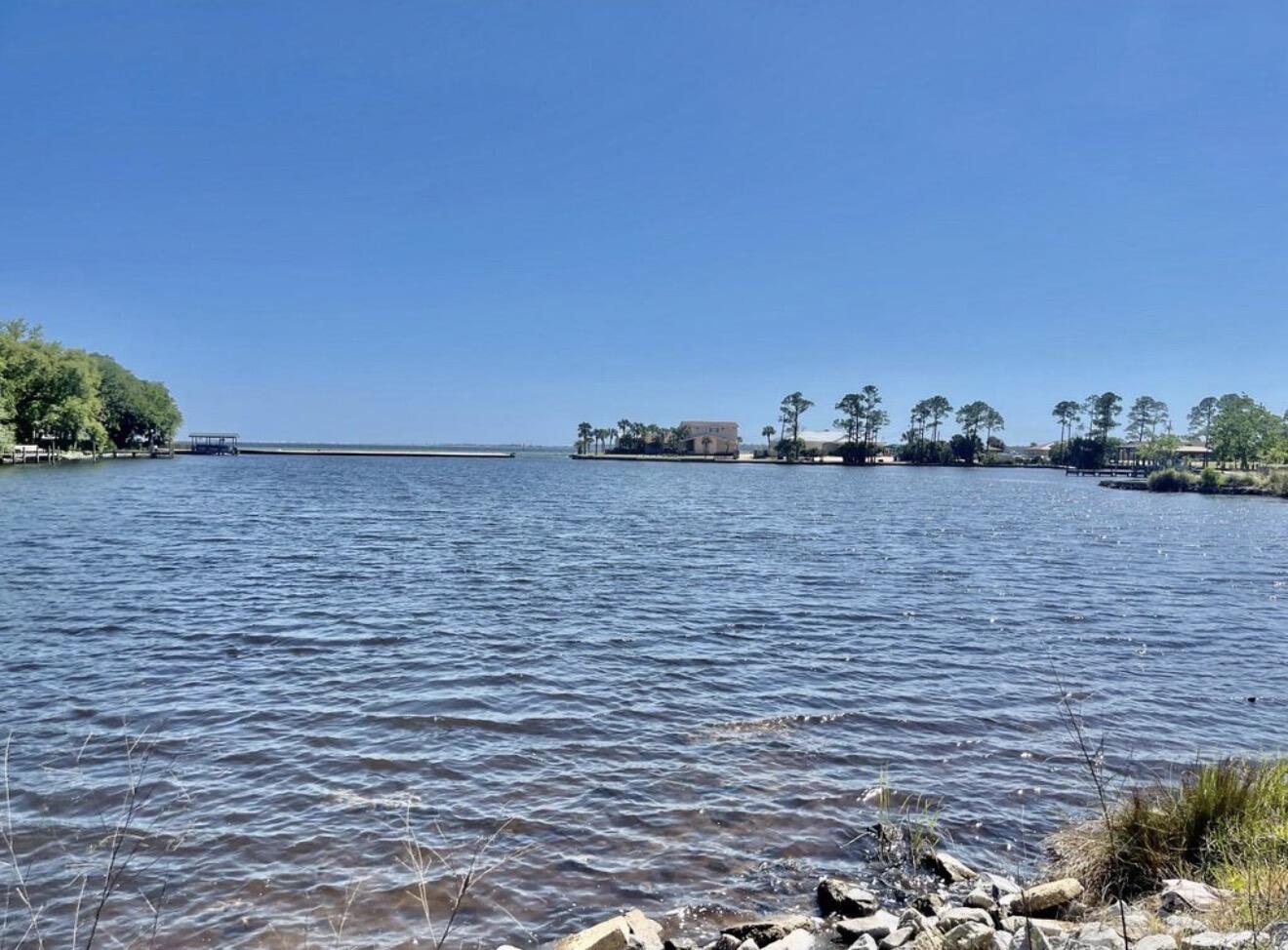 Motivated Seller! Do Not disturb tenants! Zoned Suburban Residential with multi-family development potential for triplex or fourplex construction. Fully Rented -Duplex with 2-bedroom, 2 full-bath units with spectacular views of Lake Vivian/Lake Clyde, the Choctawhatchee Bay, and Okaloosa Island on the horizon. New Roof completed in 2018. Unit A has a large screened-in porch with spectacular views of the lake. Unit A was completely remodeled in 2018, right down to the studs, with upgraded flooring, walls, updated appliances, new fixtures, and a newly replaced HVAC in 2017.Unit B features remodeled bathrooms, including an easy-access walk-in shower. Additional improvements include a new oven (2016), new water heater (2021), new HVAC system (July 2022), updated appliances, and LVP new flooring. A new 150-foot sewer line was installed on 4/2023. The County completed a project that elevated Meigs Drive in front of the property to improve drainage. Buyer to verify all measurements.