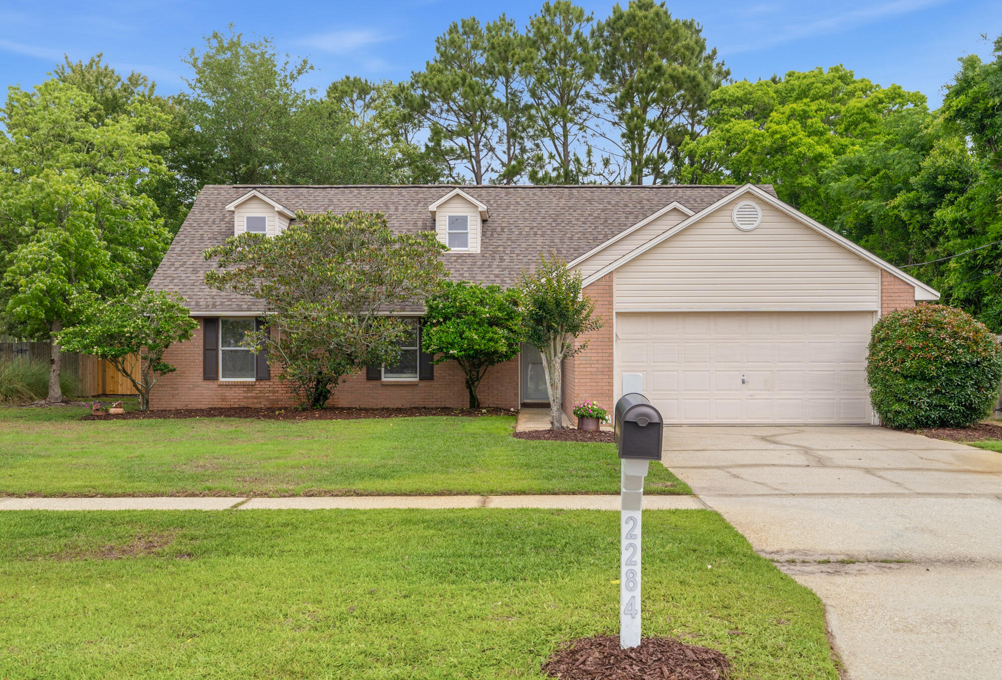 Space, style, and flexibility - this East Navarre home delivers it all. This 4BR/3BA home with a 2-car garage offers a layout designed for real life. The beautiful new and inviting living room flooring directs you across to a beautifully tiled outdoor patio beyond the paneled sliding glass doors.  Great natural lighting and new retractable ceiling fans add elegance and circulation. Upstairs, a spacious loft with LVP flooring, private bedroom, full bath, and 2 storage closets create the perfect setup for guests, a 2nd living area, or multi-gen living. The master suite is conveniently located on the 1st floor. The spacious kitchen has gorgeous granite countertops, and big-ticket updates are already handled for peace of mind, including a newer roof (2022), energy efficient windows (2020), HVAC and water heater (2026). Enjoy the freedom of no HOA, and the convenience of being close to stores, restaurants, and best of all - within 5 miles from the beach! Whether you're hosting, relaxing, or working from home, this one checks all the boxes! Schedule a tour and come see for yourself!