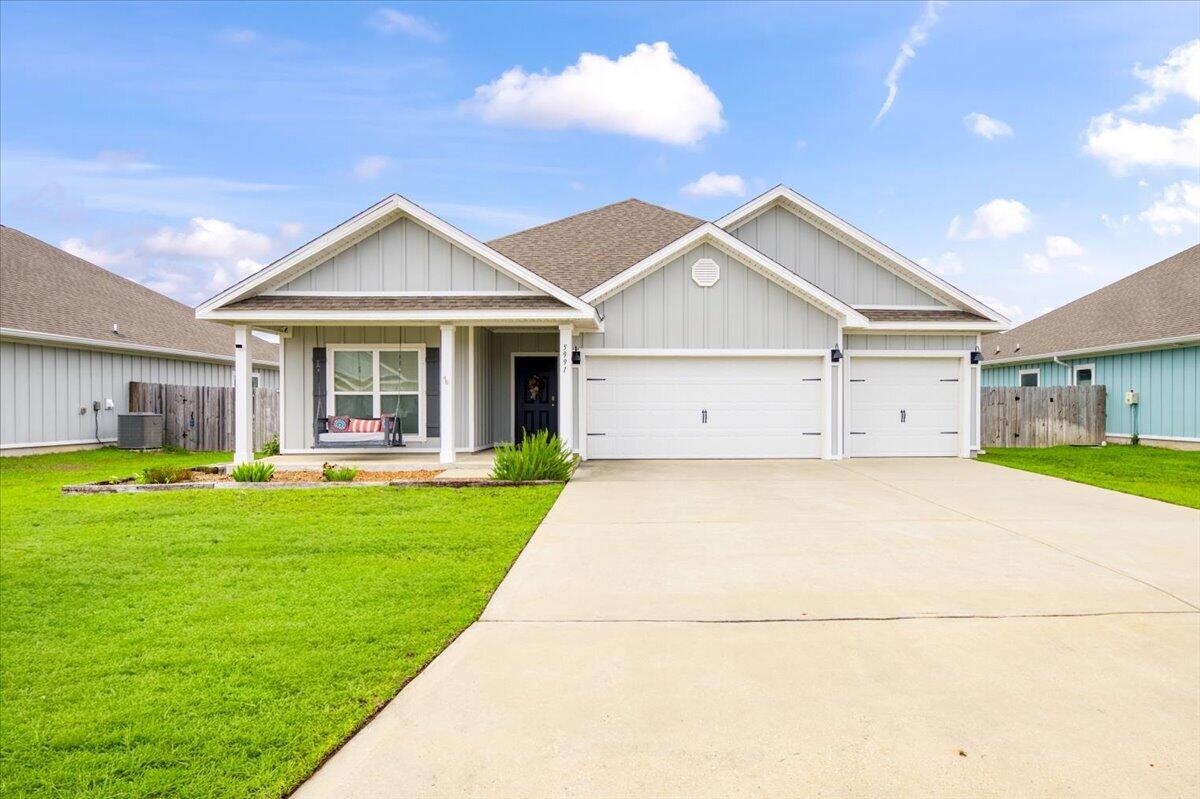 Turnkey and move-in ready, this beautifully maintained 2021 Craftsman-style home offers modern finishes, thoughtful design, and an unbeatable location in Gulf Breeze! Situated in the Forest Bay Estates community, residents enjoy access to a sparkling community pool, pavilion, and sidewalks, all while being just minutes from Highway 98 for an easy commute to both Navarre and Pensacola. Inside, the open-concept layout is enhanced by durable luxury vinyl plank flooring throughout with NO carpet, neutral paint, Levolor cordless blinds, and abundant natural light. The spacious living room showcases a trey ceiling with recessed lighting and flows seamlessly into the dining area and kitchen. Designed for both everyday living and entertaining, the kitchen features a large granite-topped island with additional storage, stainless steel appliances, a generous pantry complete with a custom spice rack, and an adjoining breakfast nook. The split-bedroom floor plan offers privacy for the spacious primary suite, complete with a trey ceiling, oversized walk-in closet, and an ensuite bath featuring granite double vanities, a water closet, and plenty of storage. The additional bedrooms are thoughtfully positioned throughout the home, while both guest bathrooms include granite-topped vanities and tub/shower combinations. Step outside to a fully fenced backyard with a privacy fence and a 12'5'' x 15' covered patio, an ideal space for relaxing or entertaining. The oversized three-car garage include s pull-down attic access for convenient storage. Additional highlights include fabric hurricane shutters, a smart home package with keyless entry and a video doorbell, and zoning for the brand-new Soundside High School! Conveniently located just 20 minutes from both Navarre Beach and Pensacola Beach, this home delivers on coastal living.