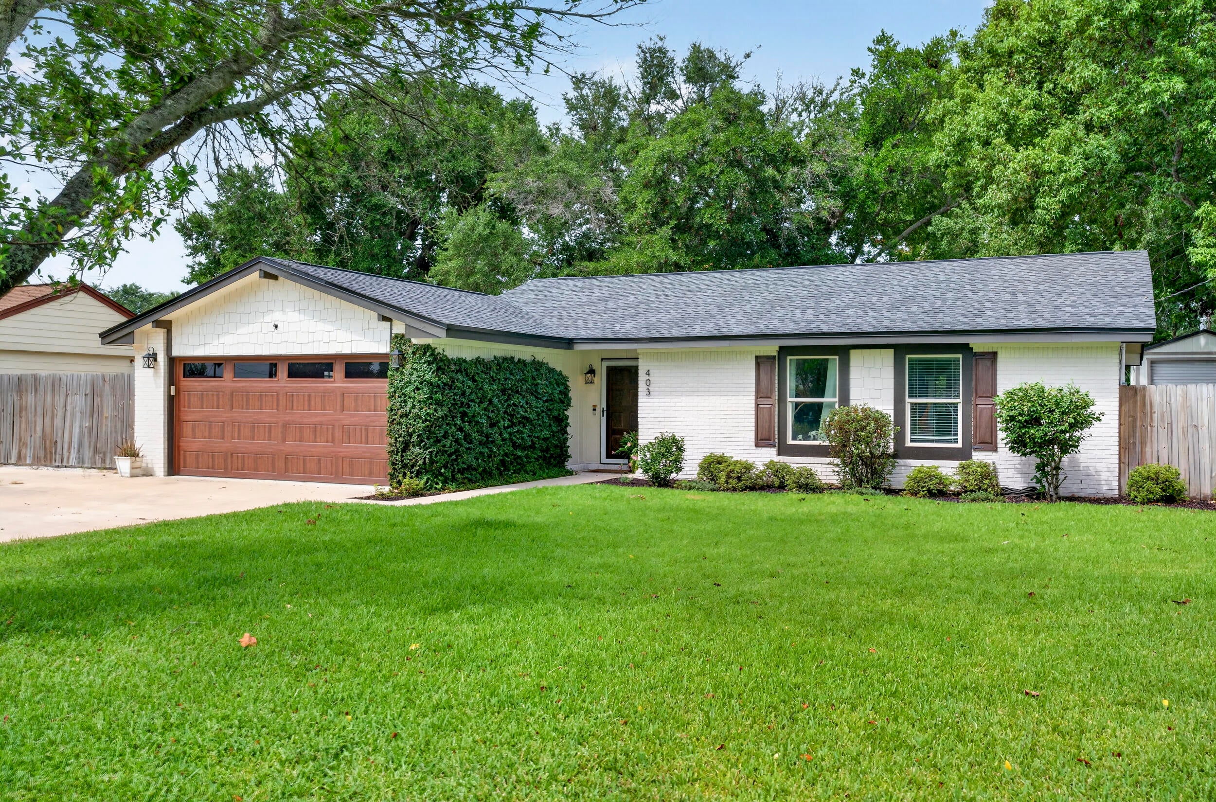 Beautifully maintained all-brick Destin home offering 3 bedrooms, 2 baths and 1,515 sq ft just minutes from the beaches, Destin Harbor and Joe's Bayou! Thoughtfully renovated and continually improved, this home features a 2024 roof, newer windows/doors, wide-plank tile flooring, raised ceilings, recessed lighting and painted pine tongue-and-groove accents for a warm coastal feel. The kitchen offers custom cabinetry to the ceiling, butcher block countertops, tile backsplash, under-cabinet lighting and stainless appliances; all kitchen appliances convey. The primary suite features a renovated bath and custom built-in closet system. One guest bedroom includes a built-in office with cabinetry and dual workspaces that can be removed if desired. Outside, enjoy a large concrete patio, outdoor kitchen, outdoor shower, oversized fenced backyard, 12x24 shed, paver walkway and landing area, sprinkler system with well, and dedicated boat/trailer parking. Additional features include an expanded driveway, laundry room addition with washer/dryer hookups, oversized 2-car garage with steel door and quiet side-mount opener, decked attic storage, newer water heater and termite bond. Close to Joe's Bayou boat launches, Crab Island, shopping, dining and Destin's white-sand beaches!