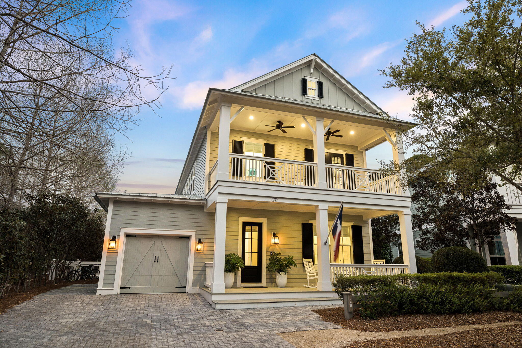 Tucked away on a large, private homesite overlooking a serene pond and natural preserve, 20 Pine Lily in WaterColor offers the rare combination of privacy, thoughtful design, and exceptional outdoor living. This never-rented residence has been meticulously maintained and is surrounded by lush landscaping, with a charming arbor guiding you from the side yard into a peaceful backyard retreat.
Designed for effortless indoor-outdoor living, the home features an expansive wraparound screened porch that overlooks a heated pool and spa, recently resurfaced for a fresh, elevated feel. Multiple outdoor gathering spaces create the perfect setting for entertaining or unwinding, including a firepit lounge, poolside seating area, and generous covered porch space ideal for year-round enjoyment. Inside, the home is equally impressive with warm pine flooring and a spacious, functional layout designed to accommodate both family and guests. The first floor features a private primary suite with direct access to the backyard oasis, along with an additional guest suite and full bath, plus a conveniently located additional laundry closet. Upstairs, a second primary suite offers a true retreat with a spa-like bath featuring a freestanding soaking tub, an oversized walk-in closet, and a private covered porch overlooking the tranquil greenspace. Two additional bedroom suites, a bunk room that comfortably sleeps four, and a loft-style living area, provide ample space for hosting.
Additional upgrades include a whole-house generator, upgraded HVAC system with air purification, enhanced shutter package, gutter system, and a one-car garage.
Owners and guests enjoy access to the unparalleled amenities of WaterColor Beach Club, featuring three Gulf-front pools, multiple dining venues, and sweeping Gulf views. The community also offers Camp WaterColor with a lazy river and water slides, tennis and pickleball courts, a lakeside boathouse with paddleboard and kayak access, and miles of scenic trails across more than 499 acres. Located along iconic 30A, WaterColor remains one of the most sought-after coastal communities, offering a lifestyle that is both relaxed and refined.