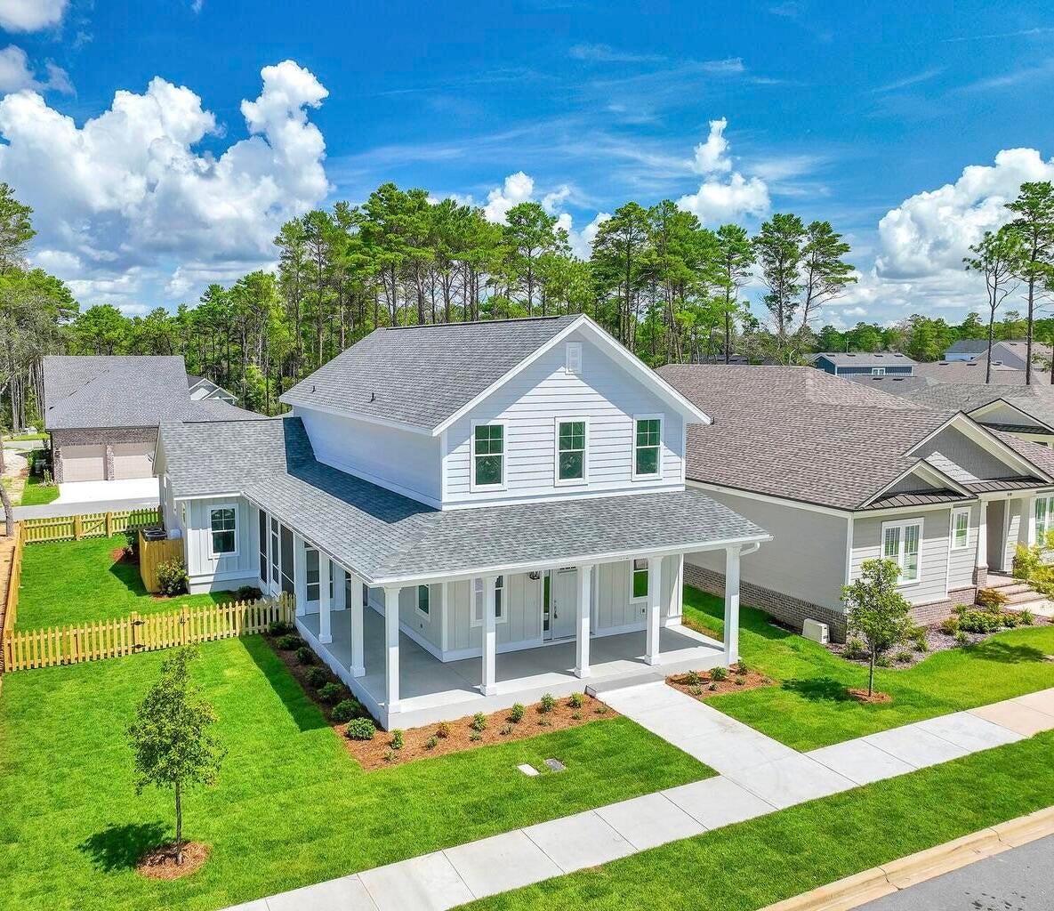 Welcome to Deer Moss Creek! This builder's model home has never been lived in and offers 3,091 square feet of thoughtfully designed living space with upscale finishes and exceptional construction details, including 4 bedrooms, 4 bathrooms, and two-story living space. The home is partially furnished, and most of the furniture currently in the home conveys with the sale.
The exterior features a front porch and screened side porch. Inside, LVP flooring extends throughout the main living areas. The living room includes a gas fireplace with built-in floating shelves.
The kitchen features quartz countertops, a large island, white farmhouse sink, and gas range. The primary bathroom includes a solid-stone soaking tub and frameless shower glass. An upstairs gathering room provides additional flexible living space.
Construction and technology features include 2x6 wall construction, ZIP System sheathing, impact windows, quartz countertops throughout, and an Air-Conditioned Garage. The home is pre-wired for surround sound, with speakers installed in the living room and garage. It is also pre-wired for wireless access points, with one WAP already installed.
Additional features include an alarm system with monitored smoke and carbon monoxide detectors.
The stunning home is being sold AS-IS. The builder is offering a $10,000 incentive that may be used toward rate buy-down or buyer closing costs. As the builder's model home, this property offers upgraded finishes, installed technology features, and furnishings that convey with the sale. Never previously occupied.