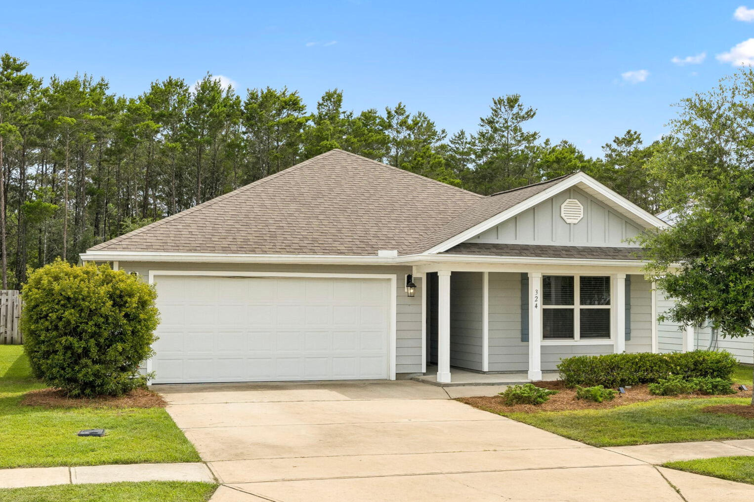 One of the best values currently available in Hammock Bay, this move-in-ready 4-bedroom, 2-bath home offers over 2,000 square feet of thoughtfully designed living space, a screened lanai, and a large fenced backyard--all priced below recent comparable sales. The open-concept layout, split-bedroom floor plan, and luxury vinyl plank flooring throughout create a comfortable, modern space ideal for both everyday living and entertaining. Located in the desirable Mill Cottages, you'll enjoy access to Hammock Bay's exceptional amenities, including four resort-style pools, fitness centers, pickleball courts, walking trails, parks, a general store, brewery, and more--all just a short drive from the beaches of 30A and the Emerald Coast.

A charming covered front porch creates a warm welcome, while the screened lanai offers the perfect place to enjoy Florida's year-round outdoor lifestyle. The expansive fenced backyard provides privacy and ample space for pets, play, gardening, or future outdoor enhancements. Additional features include rain gutters and a two-car garage. 

Located within the award-winning Hammock Bay community.