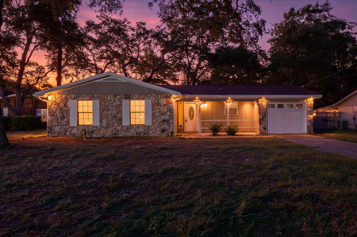 Welcome home to 127 Patti Cove!  This charming 3-bedroom 2-bath home is the perfect opportunity to settle into a welcoming community, right in the heart of Niceville. Nestled in a cul-de-sac, this property combines comfort, convenience, and value. Fresh paint and new luxury vinyl plank (LVP) flooring create a modern, move-in-ready atmosphere throughout the home. A large living area highlighted by a soaring cathedral ceiling and a cozy wood-burning fireplace, ideal for relaxing evenings at home. The living space flows seamlessly to a bright dining area and a kitchen equipped with a brand-new refrigerator!  Enjoy the convenience of an attached one-car garage and a sizable fenced backyard perfect for pets, play or entertaining. Step out onto the concrete patio directly off the living room to soak up Florida's sunshine or host weekend barbecues. Location is everything, and this home delivers! You're just minutes from Eglin Air Force Base, top-rated schools, shopping, local eateries, and the world's most beautiful beaches. Whether commuting or enjoying the vibrant coastal lifestyle, everything you need is close at hand. Don't miss your chance to own this lovely, affordable home in central Niceville. Schedule your private tour of 127 Patti Cove today!  Roof replaced 2016, water heater replaced 2025.