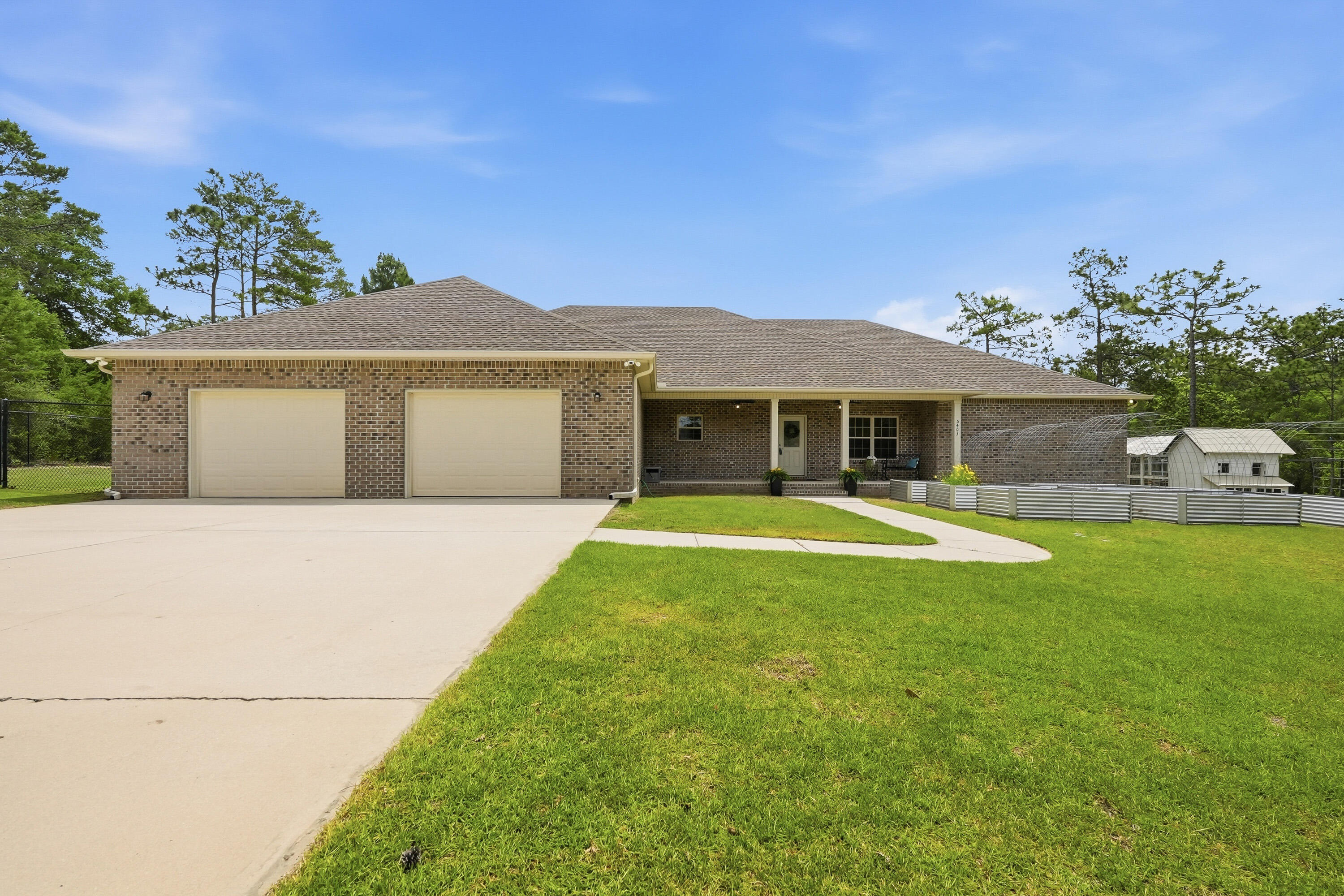 Set on approximately 2.3 acres in North Crestview, this spacious property offers the perfect blend of indoor comfort and outdoor living. A gated driveway welcomes you to this 5-bedroom, 4-bath home featuring a versatile floor plan with three bedrooms offering private en-suite baths and large walk-in closets. Enjoy multiple spaces for relaxing and entertaining, including a screened porch, open back deck, and a sparkling in-ground pool. The outdoor amenities continue with raised garden beds, a chicken coop, and an irrigation system to help maintain the grounds. With room to spread out and enjoy country-style living while still being convenient to shopping, schools, and a short commute to Eglin Air Force Base and Duke Field, this unique property offers endless possibilities.