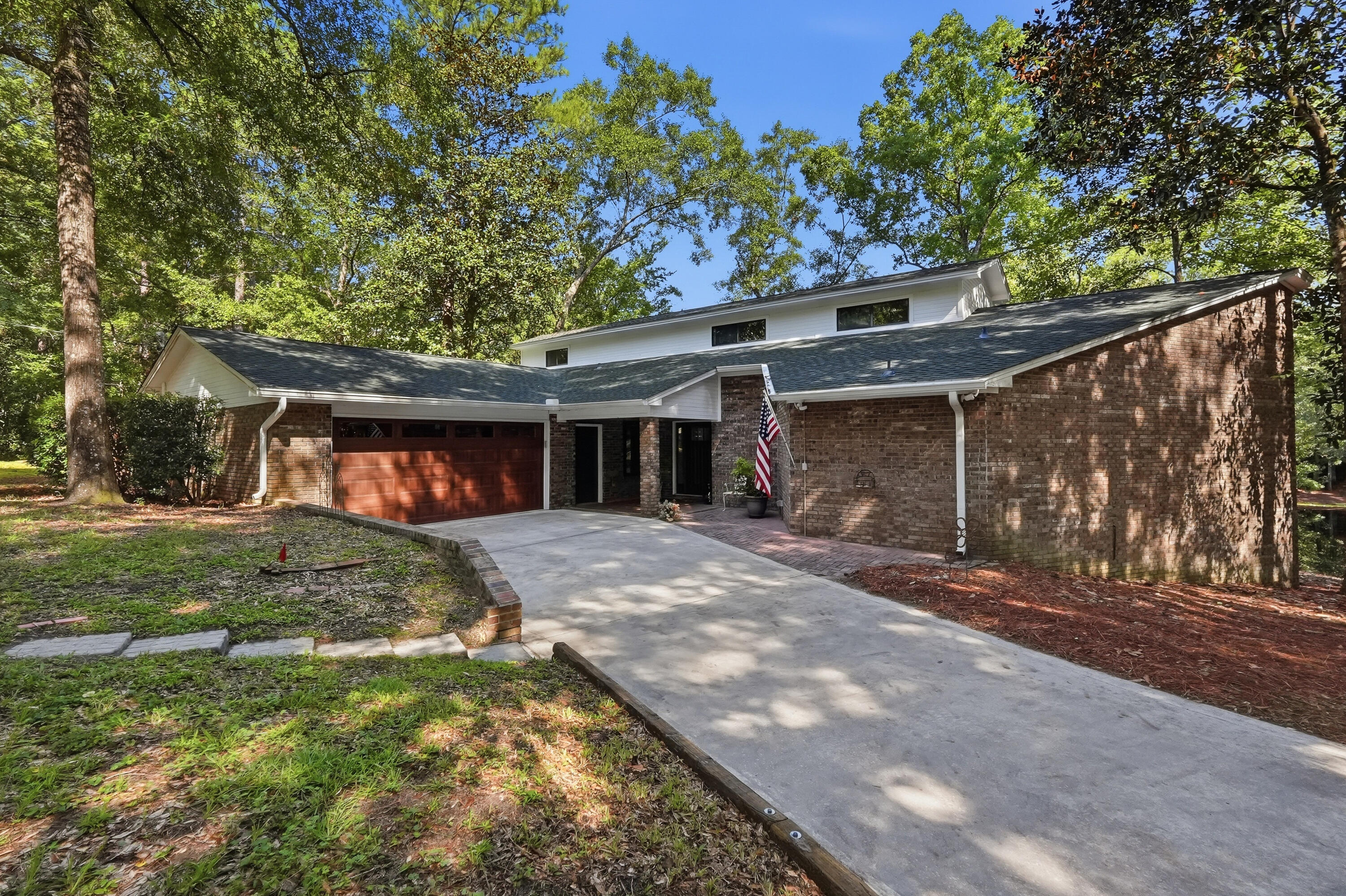 PRIVATE POND, 2.5 WOODED ACRES, AND A TRANQUIL COUNTRY SETTING JUST MINUTES FROM TOWN! This 4-bedroom, 3-bath brick home offers nearly 3,000 square feet of living space, no HOA, and the kind of privacy and breathing room that is getting harder to find.
Large windows across the rear of the home frame beautiful views of the private, year-round pond and surrounding woods, bringing the outdoors into the main living spaces. Step outside to the covered back deck and enjoy a quiet morning, an evening with friends, or simply take in the view. A newer dock sits at the water's edge and offers the perfect spot to relax or spend a little time fishing in the stocked pond.
Inside, the spacious living room features a wood-burning stove, while the updated kitchen offers quartz countertops, refreshed cabinetry with new hardware and pull-out shelving, stainless appliances, tile backsplash, a breakfast area, and a large walk-in pantry. A separate dining room gives you even more space for family gatherings and entertaining.
The oversized first-floor primary suite is another highlight, featuring its own pond view, sitting area, large walk-in closet, and remodeled bath with dual sinks and a spacious walk-in shower. Two additional bedrooms and a full bath are located upstairs, giving the home a flexible layout with most everyday living on the main level.
Nearly every room in the home has been updated in recent years, and the major systems have been addressed as well, including the roof, both HVAC systems, both water heaters, exterior doors, and flooring. Simply put, very little has been left untouched.
Outside, the two-car garage is complemented by an oversized pole barn with electric and 50-amp RV hookup, providing covered space for an RV, boat, trailer, or equipment.
Whether you are relaxing on the back deck, fishing from the dock, or simply enjoying the privacy of your own wooded acreage, this property offers a lifestyle that is difficult to replicate. Come see why 5845 White Oak Drive is the country escape you need and the access to town you want.