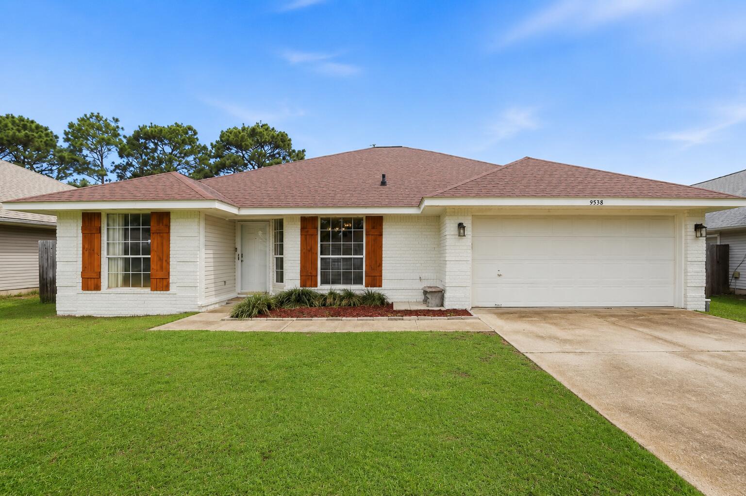 Welcome to this beautiful 4 bedroom, 2 bathroom home located in the highly desirable East Navarre area! Offering an open and spacious floor plan, this home features luxury vinyl flooring, vaulted ceilings, and numerous modern updates throughout. The kitchen is designed for both everyday living and entertaining, complete with quartz countertops, a breakfast bar, center island, stainless steel appliances, and a large pantry for added storage.

The primary suite provides a relaxing retreat with a spacious layout, ceiling fan, dual walk-in closets, and an ensuite bathroom featuring double vanities and a garden tub/shower combination. The additional bedrooms offer flexibility for guests, a home office, or growing families.

Step outside to enjoy the screened-in back patio overlooking the fully fenced backyard. The privacy fence was replaced in 2024, providing a fresh, updated outdoor space perfect for entertaining, pets, or simply enjoying your own private oasis. Additional features include an irrigation system utilizing reclaimed water and a roof replaced in 2020 for added peace of mind.

Conveniently located just minutes from Navarre Beach, Hurlburt Field, shopping, dining, and a nearby Publix, this home combines comfort, convenience, and modern living in one of Navarre's most sought-after neighborhoods. Don't miss your opportunity to make this exceptional property your next home!