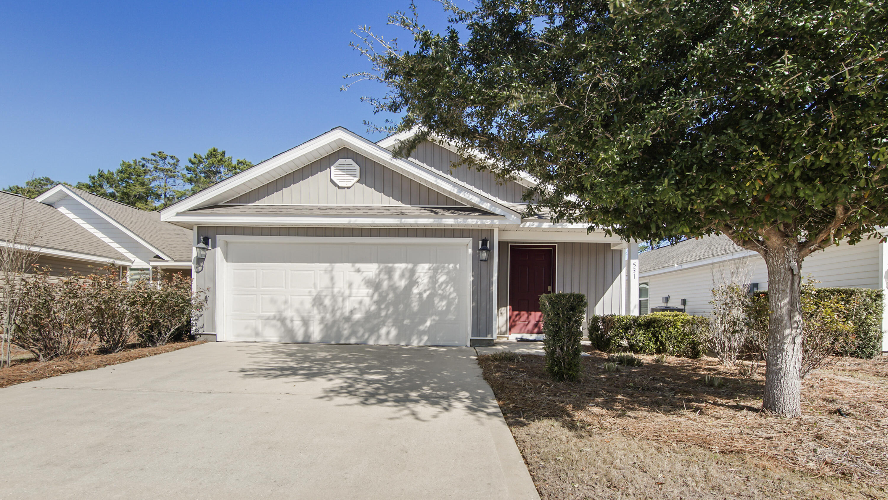 Welcome to 531 Earl Godwin Rd, Freeport, FL, located in the desirable Crescent Mill at Hammock Bay, one of Freeport's premier master-planned communities. 

This well-maintained 3-bedroom, 2-bath home features an open-concept floor plan with a covered front and back porch, integrated security system, spacious kitchen offering a large center island that opens to the living and dining areas, ideal for entertaining and everyday living. Kitchen appliances include a smooth-top range, dishwasher, refrigerator, and microwave.

The primary suite includes a walk-in closet and an en-suite bathroom with a walk-in shower and dual sink vanity. Two additional bedrooms provide ample space for family, guests, or a home office. The home also features a full laundry room conveniently located just off the foyer and front hallway, along with a two-car garage. It also offers a low-maintenance backyard space, perfect for relaxing outdoors without the upkeep of a large yard.

Monthly HOA dues of $341.14 include over 150 cable channels, access to all community pools, fitness center, multiple clubhouses with movie theatre, tennis, pickleball and basketball courts, playground, and fishing pier. HOA also covers full yard maintenance including mowing, fertilizing, and mulch. Enjoy low-maintenance living with resort-style amenities in a prime Freeport location. What are you waiting for? Call and make this home yours today!