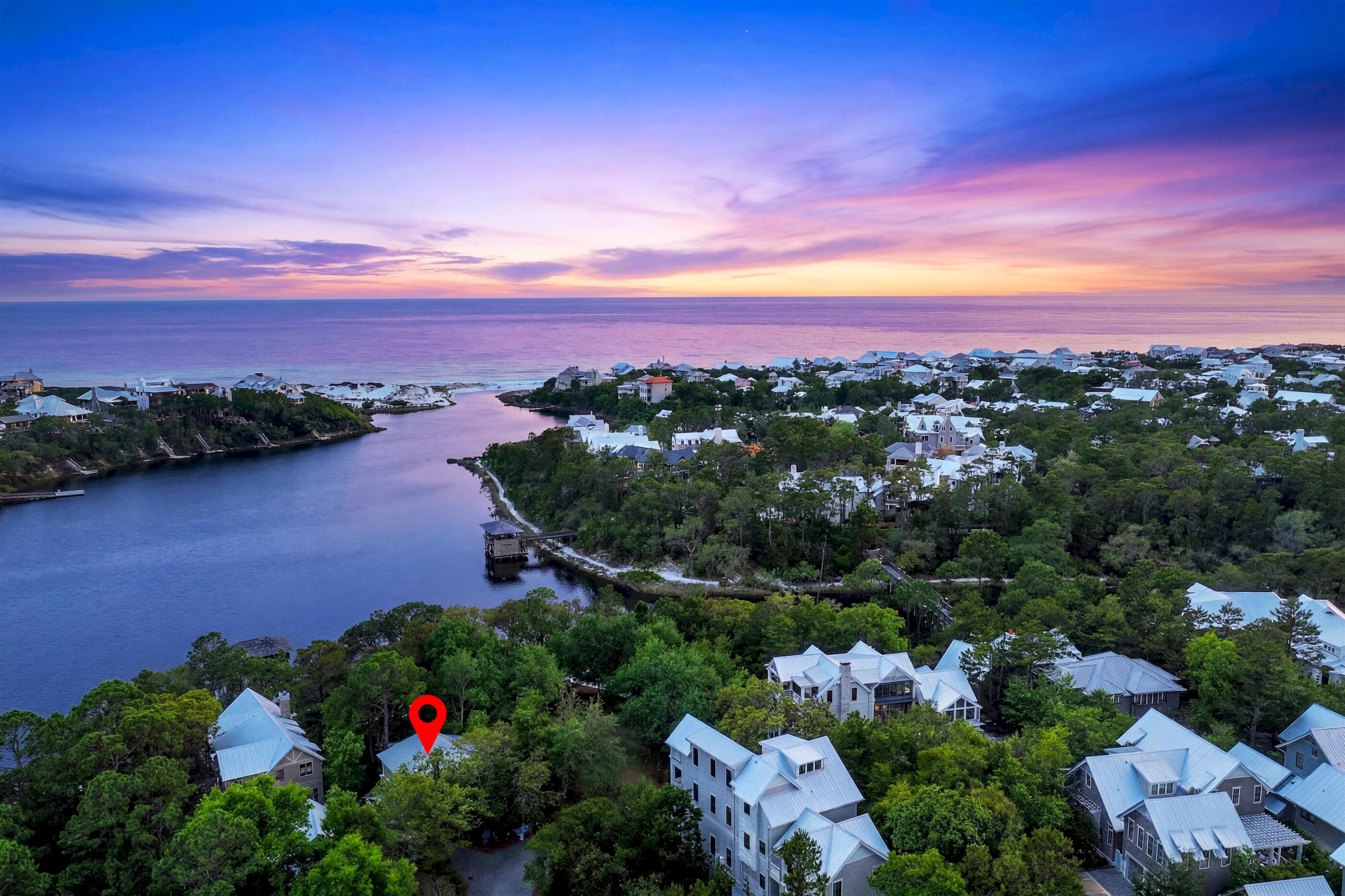 Tucked within the exclusive gated, non-rental community of Draper Lake Coastal Village, this extraordinary homesite with its standalone carriage house offers one of the rarest ownership opportunities on all of 30A. Perfectly positioned on one of the highest elevations in Blue Mountain Beach, this remarkable property captures sweeping views of Draper Lake, protected coastal dunes, and the Gulf, delivering an incredibly rare combination of lake, nature preserve, and beach lifestyle in one exceptional setting. What truly sets this property apart is its exceptional rarity. It is one of the only lots in Draper Lake with just one neighboring homesite, bordered by protected greenspace and the Butterfly Garden, creating an unmatched sense of privacy and openness. The property also enjoys direct access to one of the community's highly coveted boathouses, offering effortless access for paddleboarding, kayaking, canoeing, fishing, and exploring Draper Lake's rare coastal dune lake ecosystem. The existing standalone carriage house is itself a remarkable asset, an opportunity that can no longer be replicated under current development guidelines. Combined with included custom home plans and the ability to build up to three stories, this property offers extraordinary flexibility to immediately enjoy as a luxurious coastal retreat while preserving the opportunity to create a future legacy home with breathtaking lake and Gulf views from multiple levels. Surrounded by protected natural beauty, scenic walking paths, and close proximity to the Long Leaf Pine Greenway and extensive nature trails, this homesite embodies the charm of Old Florida while offering the privacy, exclusivity, and architectural consistency that define Draper Lake Coastal Village. Here, residents enjoy a lifestyle where adventure and tranquility seamlessly coexist--walk or bike to nearby dining and shopping, launch directly onto the lake, access a protected beach, or simply enjoy the peaceful surroundings of one of the most beautiful and ecologically preserved settings along 30A. Its location is equally compelling--quietly tucked away from the congestion of 30A, yet ideally situated in the heart of Blue Mountain Beach with easy access to the very best of the Emerald Coast. This unique property is perfectly suited for a wide range of buyers, from adventurous families seeking an active coastal lifestyle, to retirees desiring serenity and beauty, to those seeking a legacy property with future expansion potential. Whether enjoyed today as an elegant low-maintenance getaway or transformed into a world-class custom estate, this homesite represents one of the most unique and compelling offerings currently available on Draper Lake.
For buyers seeking privacy, protected views, natural beauty, architectural integrity, and an irreplaceable position within one of 30A's most special communities, this is truly a generational opportunity. Properties of this caliber, uniqueness, and future potential rarely come to market.