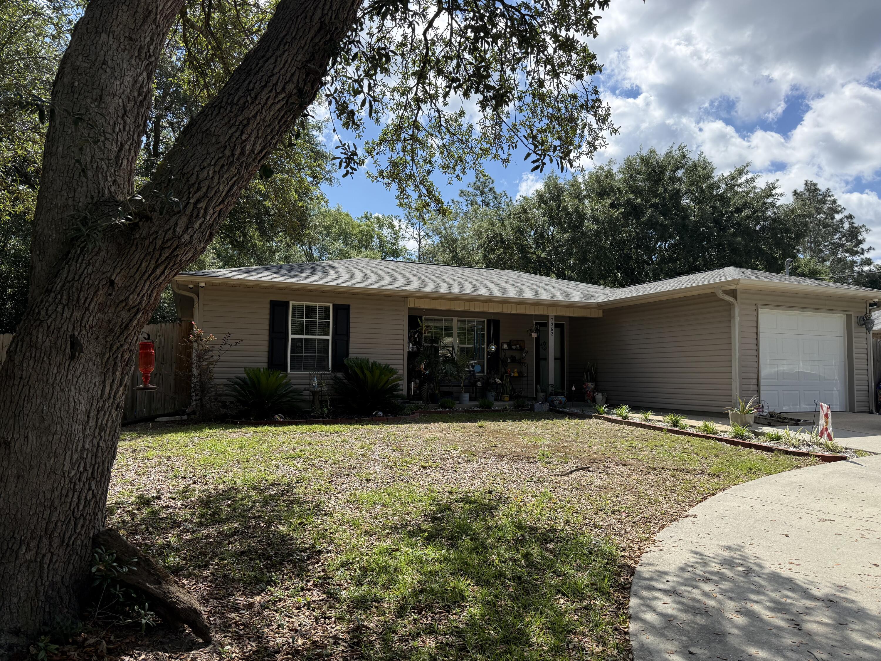 Peaceful setting near NAS Whiting Field on a spacious .36 acre lot.  This 3-bedroom 2-bathroom home offers a split floor plan with an open design that connects the kitchen, breakfast nook, and living room.  The kitchen is fully equipped and is open to the dining space, making it practical for everyday use and entertaining.  The split bedroom floor plan offers privacy, and each bedroom features a walk-in closet.  The fully fenced backyard gives you plenty of options for gardening, games, grilling, or just relaxing.  Prewired security cameras will convey.  A new roof was installed in 2022.