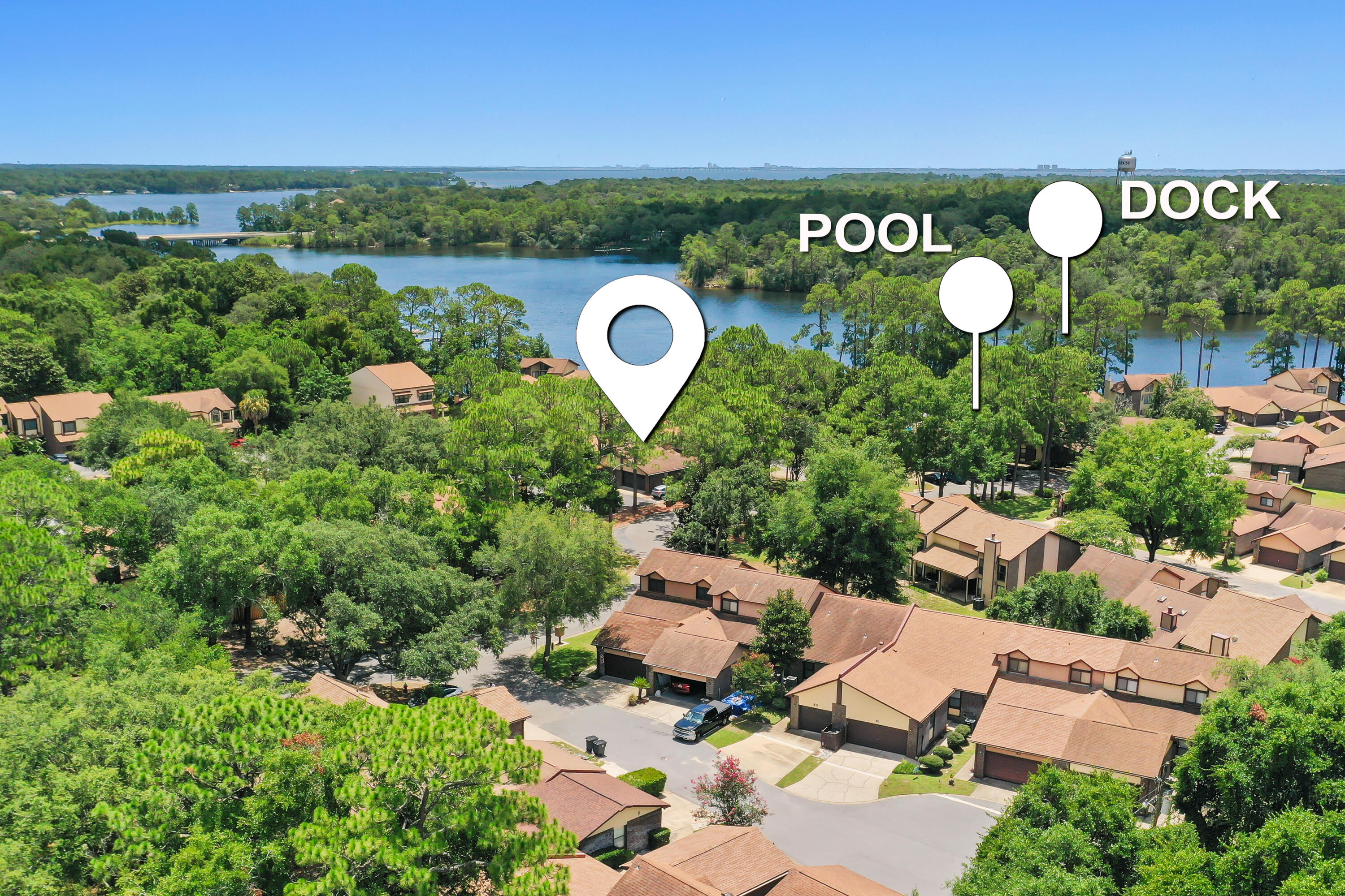 Waterfront living without the waterfront price! Welcome to Hidden Cove, a peaceful waterfront community on Tom's Bayou where residents enjoy a community pool, private dock with boat slips available for lease, and beautiful mature landscaping. This desirable end-unit townhome offers one of the community's most sought-after floor plans with a first-floor primary suite, soaring ceilings, abundant natural light, and a versatile loft featuring brand-new carpet.

Step inside to find hardwood flooring throughout the foyer, living room, dining area, and primary bedroom, with tile in the kitchen, bathrooms, and Florida room. The spacious living area flows into the light-filled Florida room, creating the perfect space to relax, entertain, or enjoy your morning coffee.

The first-floor primary suite provides convenience and privacy, while upstairs you'll find two additional bedrooms, a full bath, and a generous loft ideal for a home office, media room, or guest retreat. Brand-new carpet throughout the upstairs bedrooms, loft, and staircase gives the second level a fresh, updated feel.

Additional highlights include a new water heater (2026), a two-car garage, and a location directly across from the community amenities, making it easy to enjoy the pool and waterfront dock.
Whether you're looking for a full-time residence, second home, or low-maintenance coastal retreat, Hidden Cove offers a unique lifestyle just minutes from Eglin Air Force Base, shopping, dining, beaches, Conveniently located near Eglin AFB, shopping, dining, and the Emerald Coast's beautiful beaches, Hidden Cove is one of Valparaiso's hidden gems for waterfront living.
