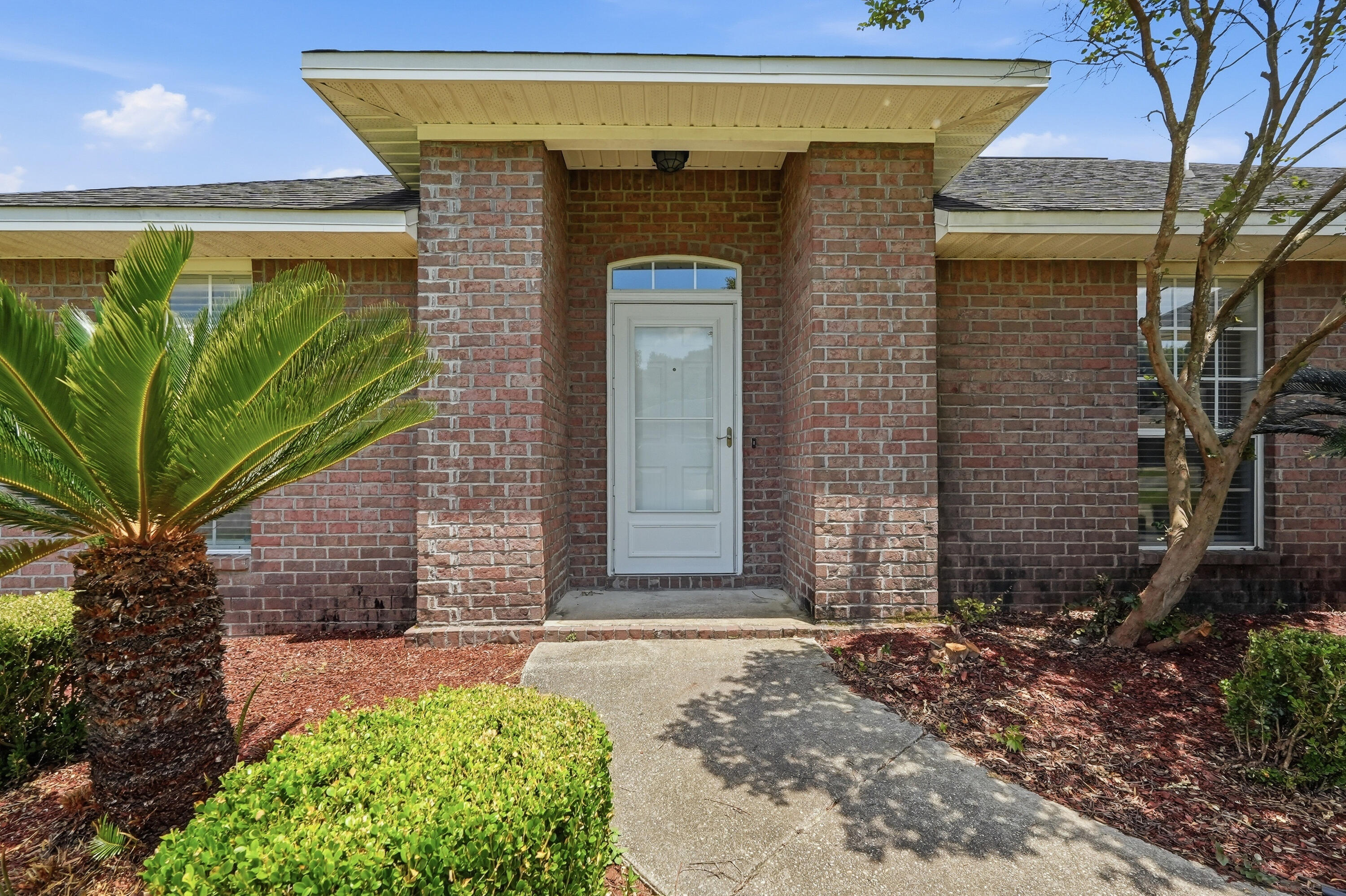 BEST PRICE IN LEE FARMS! Don't miss this opportunity! Come see this all brick 4 bedroom, 2 full bath home in Lee Farms. The HOA maintains the integrity of the neighborhood but fees are only $100 annually! The welcoming open floor plan draws you into the great room featuring sliding glass doors leading to an open patio and large fully fenced backyard. An eat-in kitchen with breakfast bar has stainless steel appliances, warm wood cabinets and granite counter tops. The spacious primary suite includes a walk in closet as well as en-suite bath with soaking tub, separate shower and double vanities. The home has been freshly painted and has all laminate and tile flooring throughout, no carpet!