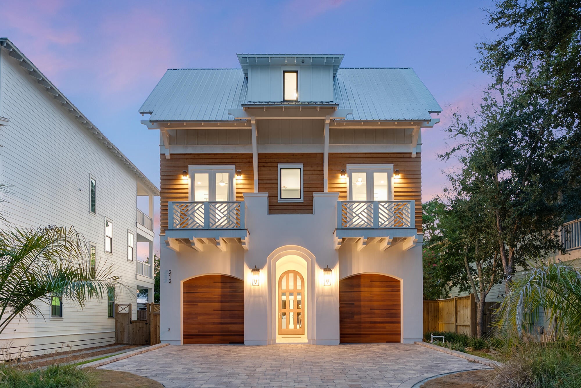 South of Scenic Highway 30A in the Eastern Lake area of Santa Rosa Beach, 212 S Gulf Drive delivers a modern expression of coastal living defined by scale, light, privacy, and proximity to the Gulf. Built in 2024, this six-bedroom residence combines contemporary architecture, a private heated pool, multiple living spaces, two primary suites, and the flexibility of no HOA, creating a compelling option for full-time living, a second home, or a luxury vacation property along 30A. The architecture is designed around connection. Floor-to-ceiling windows bring natural light deep into the home, while expansive living, dining, and kitchen spaces create an effortless flow between everyday life and entertaining. The kitchen anchors the main level with refined finishes, generous workspace, and a layout that feels equally suited to quiet mornings, family dinners, and evenings spent hosting.

Across three thoughtfully designed levels, the home offers six bedrooms, five full baths, two half baths, multiple gathering spaces, an elevator, and a two-car garage. Two spacious primary suites introduce an additional level of flexibility for owners and guests, while secondary living areas and balconies allow the home to shift naturally between connection and retreat.

Outside, the private heated pool becomes an extension of the interiors, creating a setting for mornings in the water, unhurried afternoons, and evenings outdoors beneath the coastal sky. Beach access is located nearby, placing the Gulf of Mexico within easy reach while maintaining the privacy and residential character of the home.

The Eastern Lake setting places 212 S Gulf Drive within one of the most recognizable stretches of South Walton, with convenient access to Seagrove Beach, Scenic Highway 30A, nearby coastal communities, dining, recreation, and the broader lifestyle that continues to draw buyers to Santa Rosa Beach.

With no HOA and short-term rentals permitted, the property offers meaningful flexibility for buyers considering a primary residence, second home, or investment-oriented vacation property. For those searching for a newer construction home south of 30A, a six-bedroom residence near Eastern Lake, a Santa Rosa Beach home with a private heated pool, or a coastal property with no HOA, 212 S Gulf Drive stands apart through the strength of its design, scale, setting, and versatility.

Modern, considered, and distinctly connected to its surroundings, 212 S Gulf Drive captures the ease of 30A living without sacrificing presence or privacy.