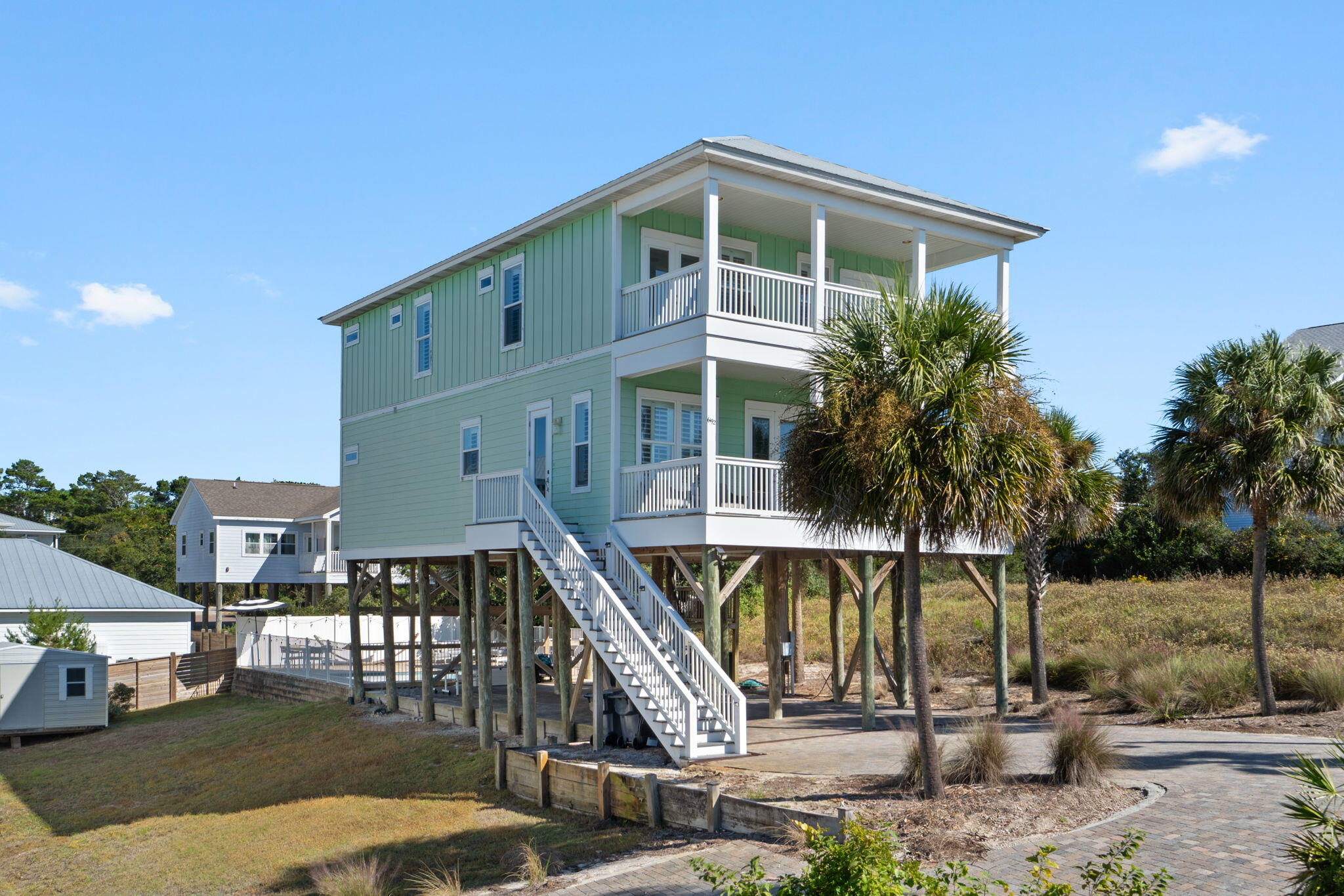 The Quintessential 30A Beach Home. Gulf Views, Private Pool & Premier Location! Just steps from the sand in Dune Allen Beach, this quintessential 30A retreat captures the essence of coastal luxury living. With approximately 2,600 square feet of interior space plus 600 square feet of Gulf-view balconies, the home blends modern comfort with timeless beachside style.

A paver driveway and classic coastal architecture welcome you to light-filled interiors designed for gathering and relaxation. The main level features a well-appointed kitchen with premium finishes, generous dining for sixteen, and seamless flow to a large balcony with grill and outdoor dining space overlooking the Gulf. Outside, a private pool and sun patio create a serene setting surrounded by palms and sea breezes. With five bedrooms and four-and-a-half baths, including three modern, updated king en-suites, the layout provides exceptional comfort for family and guests. Multiple balconies showcase sweeping Gulf views, while tasteful finishes throughout reflect an effortless 30A lifestyle.

Located just a short walk to the Dune Allen Regional Beach Access directly across from Stinky's Fish Camp, this property sits in one of the most desirable pockets of 30A where walkability, Gulf views, and laid-back sophistication define everyday living.