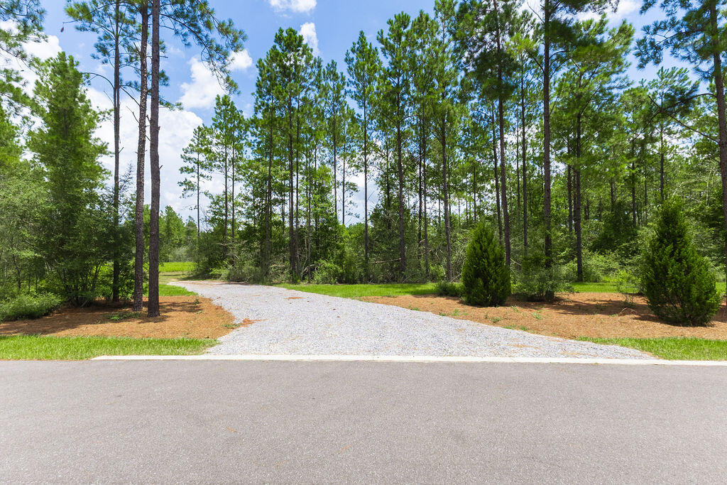 Welcome to Lot 47 on NatureWalk Drive--a stunning, highly private 5.42-acre parcel tucked away at the quiet back of the community. Offering the perfect blend of size, seclusion, and mature woods, this expansive homesite provides more than enough space for your dream estate, a guest house, or additional outbuildings. Skip the wait times and permits--the seller has already invested heavily in the land by adding: driveway, power on-site, private well, secured fencing, and strategic, partial clearing--ready for you to build!