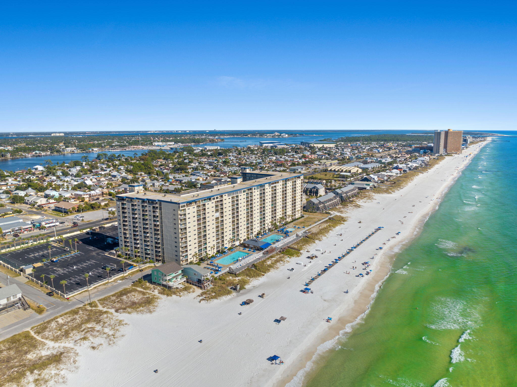 Experience the Gulf Coast lifestyle at its finest in this beautifully updated, deluxe 2-bedroom, 2-bath Gulf-front condo at Regency Towers. Situated on the 11th floor, this spacious residence offers breathtaking, unobstructed views of the Gulf of Mexico--from peaceful sunrise skies to vibrant sunset horizons. Inside, you'll find an oversized floor plan designed for both comfort and entertaining. The open layout features a generous dining area, a convenient breakfast bar, and a wide living space that flows naturally toward the balcony and its stunning water views. With sleeping accommodations for up to eight guests, including a sleeper sofa, this condo is ideal for vacation rentals, family getaways, or full-time coastal living.