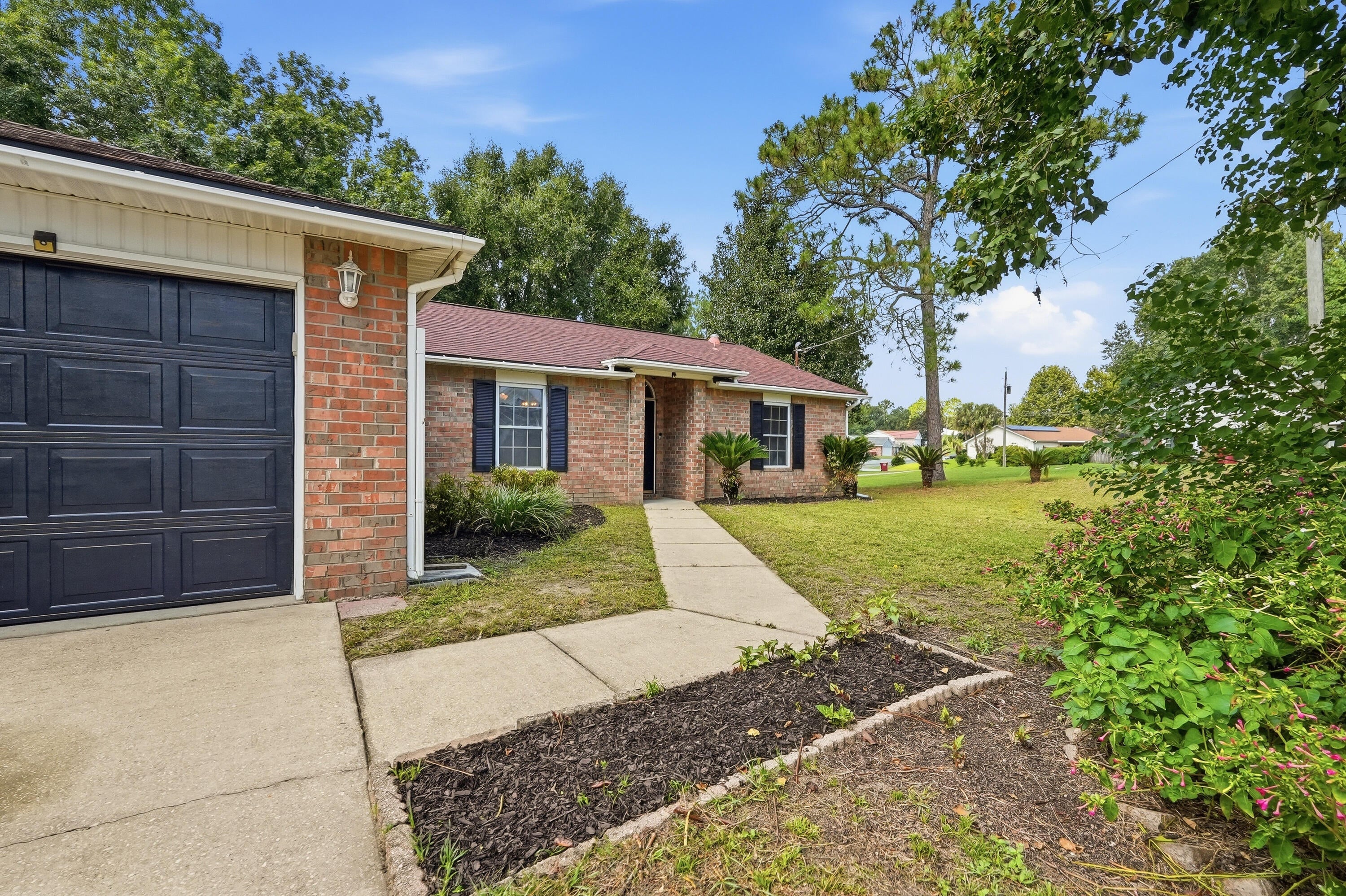Welcome to 1218 Ego Dr! This 3-bedroom, 2-bath home offers a functional layout with plenty of room to enjoy both indoor and outdoor living. As you enter, a separate dining space sits just off the main living area, offering flexibility for everyday meals, entertaining, or additional living space.

The spacious living room features vaulted ceilings and a fireplace as its focal point. The kitchen provides an island, pantry storage, and plenty of space for daily use. The primary suite includes a private bathroom and two large walk-in closets, providing plenty of additional storage.

Step outside to a spacious fenced backyard surrounded by mature trees, offering plenty of room to relax, entertain, or create your own outdoor retreat. Enjoy evenings around the backyard fire pit, plus an approximately 12' x 30' concrete pad offering flexible space for additional parking, outdoor seating, recreational use, or a future patio setup.

Parking is another great feature of this home. In addition to the two-car garage, the extended driveway provides plenty of additional parking space for multiple vehicles.

Conveniently located near shopping, dining, a nearby park, and I-10, with approximately 10-12 miles to the 7th Special Forces Group (Airborne), 12-14 miles to Duke Field, 24.5 miles to Eglin Air Force Base, and 30.6 miles to Hurlburt Field.

Come take a look and see the possibilities this Crestview home has to offer!