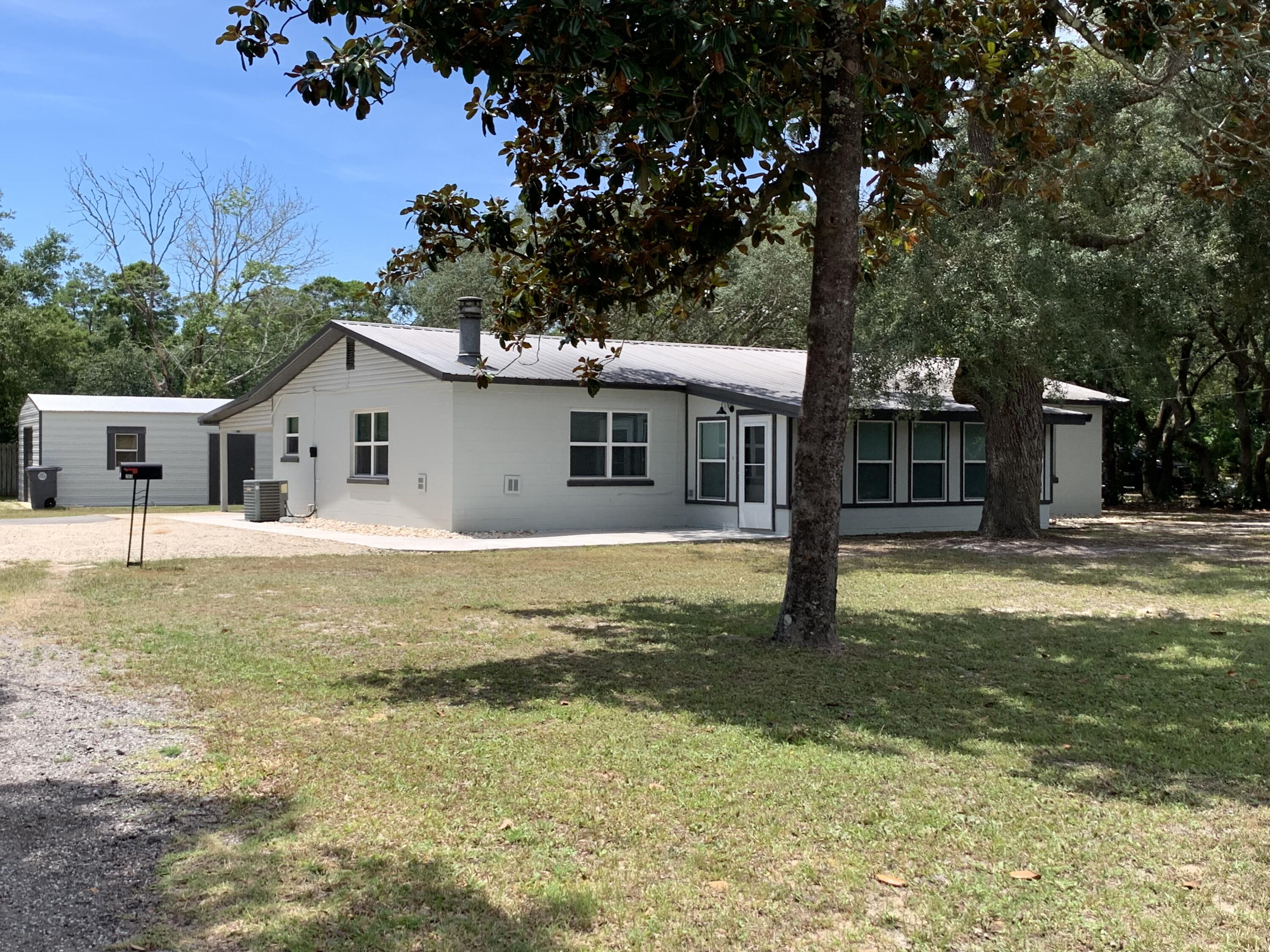 *Available to move-in June 8, 2026* 
Newly remodeled home located on a prime Valparaiso corner lot just a short distance to Lewis Elementary/Middle School, Tom's Bayou, Florida Park and just 3 minutes to Eglin's east gate. This home has beautiful tile flooring throughout the main living space, open concept kitchen/dining/living room, upgraded light fixtures, fully remodeled bathrooms with large showers, a sitting room in the master bedroom, newly added Florida room with heating/cooling, a cozy fireplace, brand new appliances, and a gas stove!! 
You'll be pleasantly surprised with the spacious lot and beautiful Florida tree in the backyard. Comes complete with a single car garage, single car carport, and 4 extra spaces outside! Text Tiffani 850-797-068