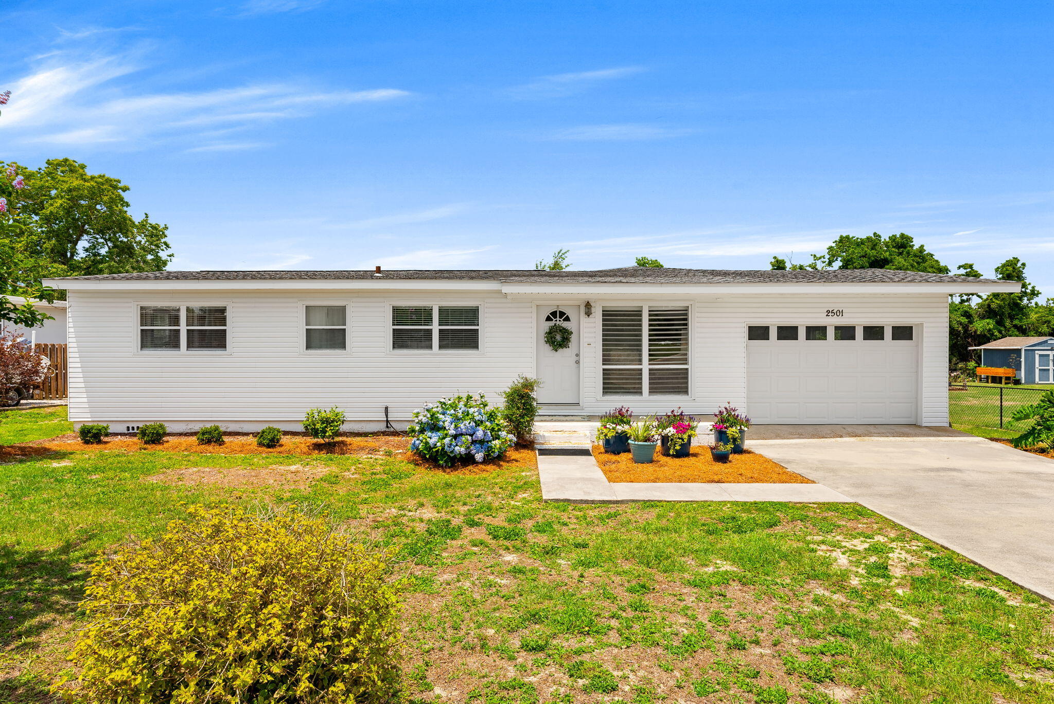 CURRENTLY UNDER CONTRACT, SELLER WILL CONSIDER BACKUP OFFERS  Welcome to this concrete block construction home nestled in the established Forest Park neighborhood of Panama City, FL. Move-in ready and full of potential, this 3-bedroom, 2-bathroom residence sits on a generous lot and offers the kind of bones buyers dream about -- including beautiful original hardwood floors just waiting to be refinished and restored to their former glory. Inside, the spacious family room invites you to relax and gather, while the eat-in kitchen provides the perfect setting for everyday meals. A dedicated laundry room with abundant storage keeps life organized. Step outside through the covered rear porch to enjoy a large, fully fenced backyard -- ideal for entertaining, pets, or play. An attached one-car garage rounds out this functional floor plan. Location is everything -- and this home delivers. Situated in the heart of Panama City, you're just minutes from grocery stores, top-rated schools, churches, hospitals, and medical offices, as well as a wide variety of local and national restaurants and retail. Whether you're a first-time buyer looking to put down roots or an investor seeking a high-demand rental location in Bay County, 2501 Rollins Avenue checks every box.