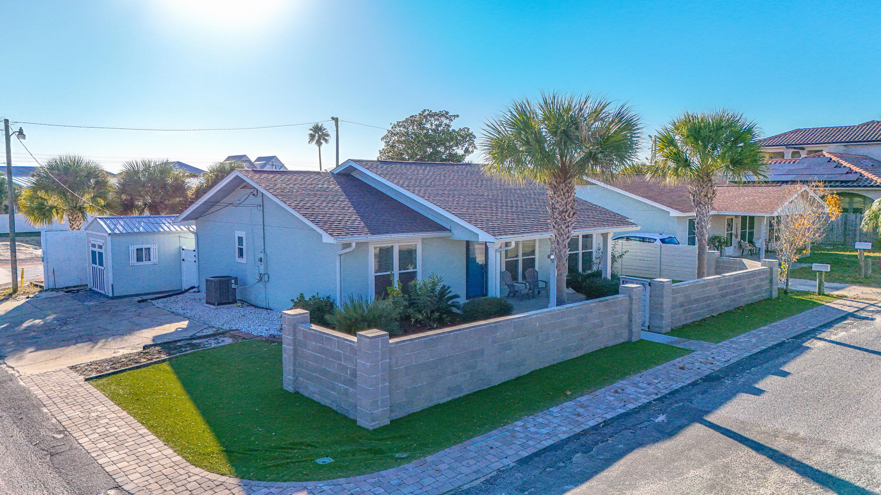 Welcome to your beach getaway, just 500ft to the beach! Located in the heart of highly coveted Laguna Beach on the West End, celebrated for its relaxed, much quieter and more peaceful atmosphere compared to the bustling energy of the East End of Panama City Beach. This beautifully updated 3-bedroom, 2-bathroom coastal cottage sits just a short unobstructed 500-foot stroll from 2 public beach accesses into the sugar-white sands of the Gulf. Offering the perfect blend of beachside lifestyle, privacy, and investment potential with no HOA, this property is ideal to live in full-time, part-time, or rent out due to low overhead, zero lawn maintenance, and incredible proximity to the water. Situated on a desirable corner lot, this 1,353-square-foot single-story home features a bright, open layout with brand-new luxury vinyl plank flooring, a fully remodeled kitchen with stainless steel appliances, and tastefully renovated bathrooms, including a custom walk-in tile shower in the primary suite. The home has been thoughtfully upgraded for peace of mind with a brand-new roof, impact-rated windows, a new air handler, and freshly updated interior finishes throughout. Outside, you will find a private fenced backyard perfect for relaxing or future enhancements, alongside ample off-street parking, a large owner's lock-out storage room, and an oversized 10x14 golf cart shed with double doors for easy access. Tucked away from the heavy tourist traffic yet perfectly situated, you are only minutes from Pier Park and roughly five miles from the upscale lifestyle of Scenic Highway 30A. This quiet, highly walkable neighborhood puts local favorites like Thomas Donut & Snack Shop and Carousel Supermarket just steps from your door. With its rare combination of a peaceful location, close proximity to the Gulf, and recent updates, this is truly one of the most versatile opportunities in Laguna Beach. Schedule your showing today and claim your quiet slice of paradise!