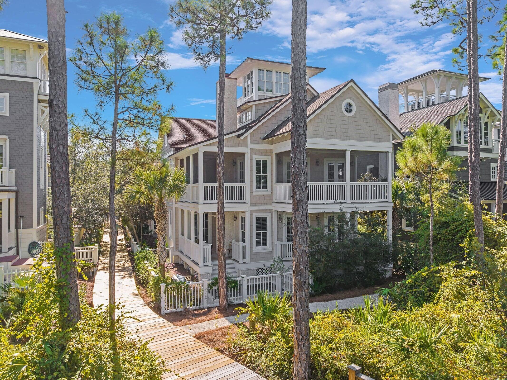 This magnificent custom-built residence sits within the prestigious Gulf-front enclave of WaterSound, offering unparalleled luxury across four impeccably designed floors. At the pinnacle lies the lookout tower, a serene retreat to savor breathtaking panoramic views of the Gulf during sunset. A refreshing Jacuzzi pool awaits, complemented by a separate carriage house atop a two-car garage.
The interior exudes warmth with heart-of-pine flooring and shiplap accents, harmonizing with the natural surroundings. 
You are just a short walk to the gorgeous beach and the neighborhood pool