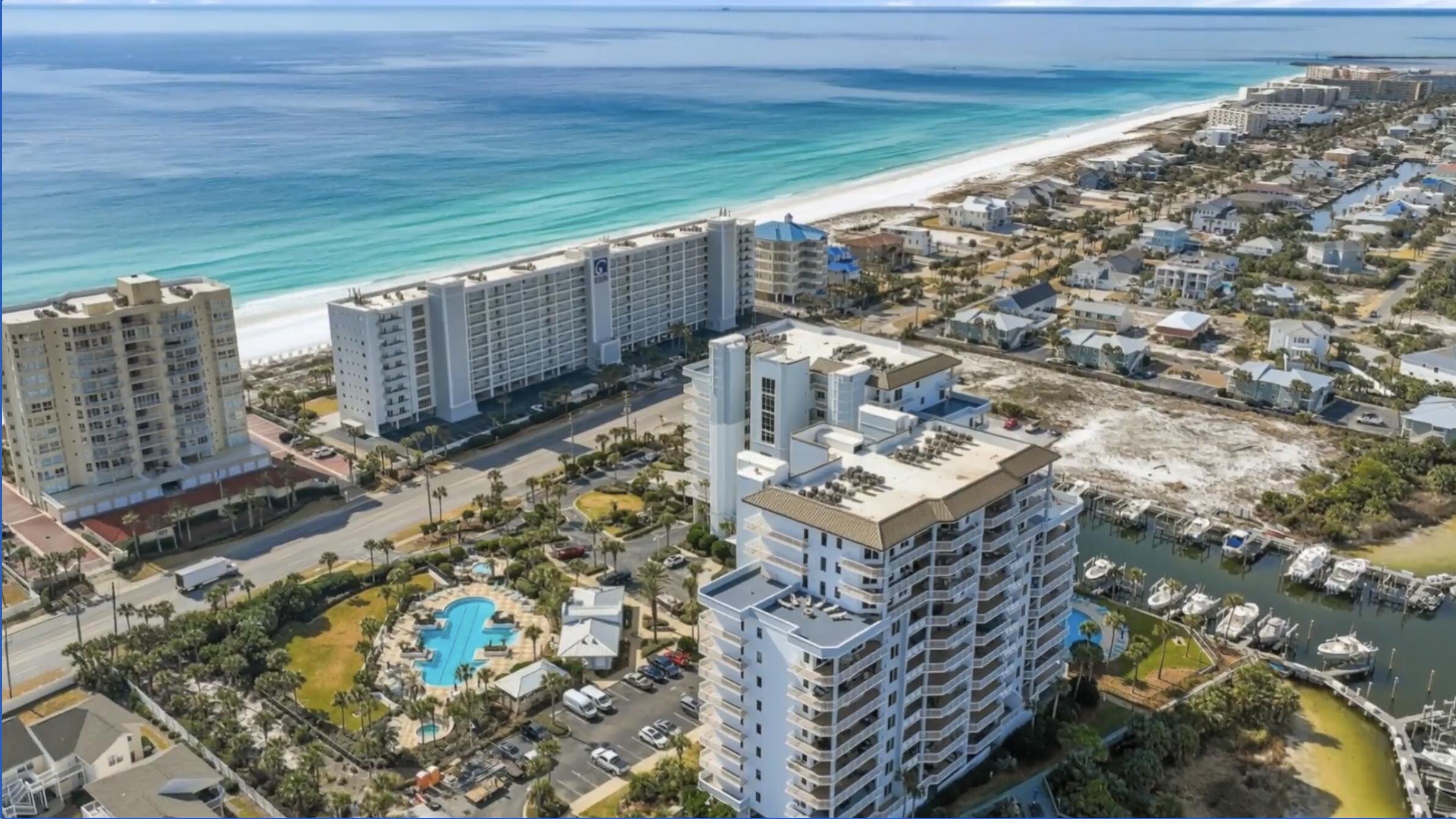 Wake each morning to harbor views and end your evenings watching spectacular sunsets, Thursday night fireworks, and the iconic Destin boat parades, all from the comfort of your own private waterfront retreat. Harbor Landing IS one of Destin's desired luxury condominium communities, where effortless coastal living meets world-class amenities.

Offered fully furnished and turnkey, this beautifully appointed residence was designed to embrace its incredible waterfront setting. Floor-to-ceiling glass fills the open-concept living space with natural light, while an expansive covered balcony stretching the full length of the home creates a seamless indoor-outdoor lifestyle, perfect for morning coffee, sunset cocktails, or entertaining against the backdrop of the Destin Harbor.

The thoughtfully designed kitchen blends functionality with timeless elegance, featuring granite countertops, stainless appliances, upgraded wood cabinetry with abundant storage, accent lighting, and generous workspace for gathering with family and friends. Each spacious bedroom serves as a private retreat with its own en-suite bath, while a convenient powder room offers added comfort for guests. A private storage room just steps from the elevator and a rare deeded oversized detached one-car garage provide exceptional convenience and storage seldom found in condominium living.

For boating enthusiasts, Harbor Landing offers the opportunity to own or lease a deep-water boat slip within the private marina, and deeded beach access just across the street, placing both the harbor and the sugar-white sands at your doorstep.

Perfectly positioned in the heart of Destin, you're only minutes from HarborWalk Village, award-winning waterfront dining, boutique shopping, championship fishing, and the vibrant coastal lifestyle that has made Destin one of Florida's premier waterfront destinations.

Whether you're seeking an elegant primary residence, an exceptional second home, or a luxury vacation rental with outstanding income potential, this remarkable Harbor Landing residence offers far more than a place to live--it offers a lifestyle defined by boating, beaches, unforgettable sunsets, and the very best of Destin waterfront living.