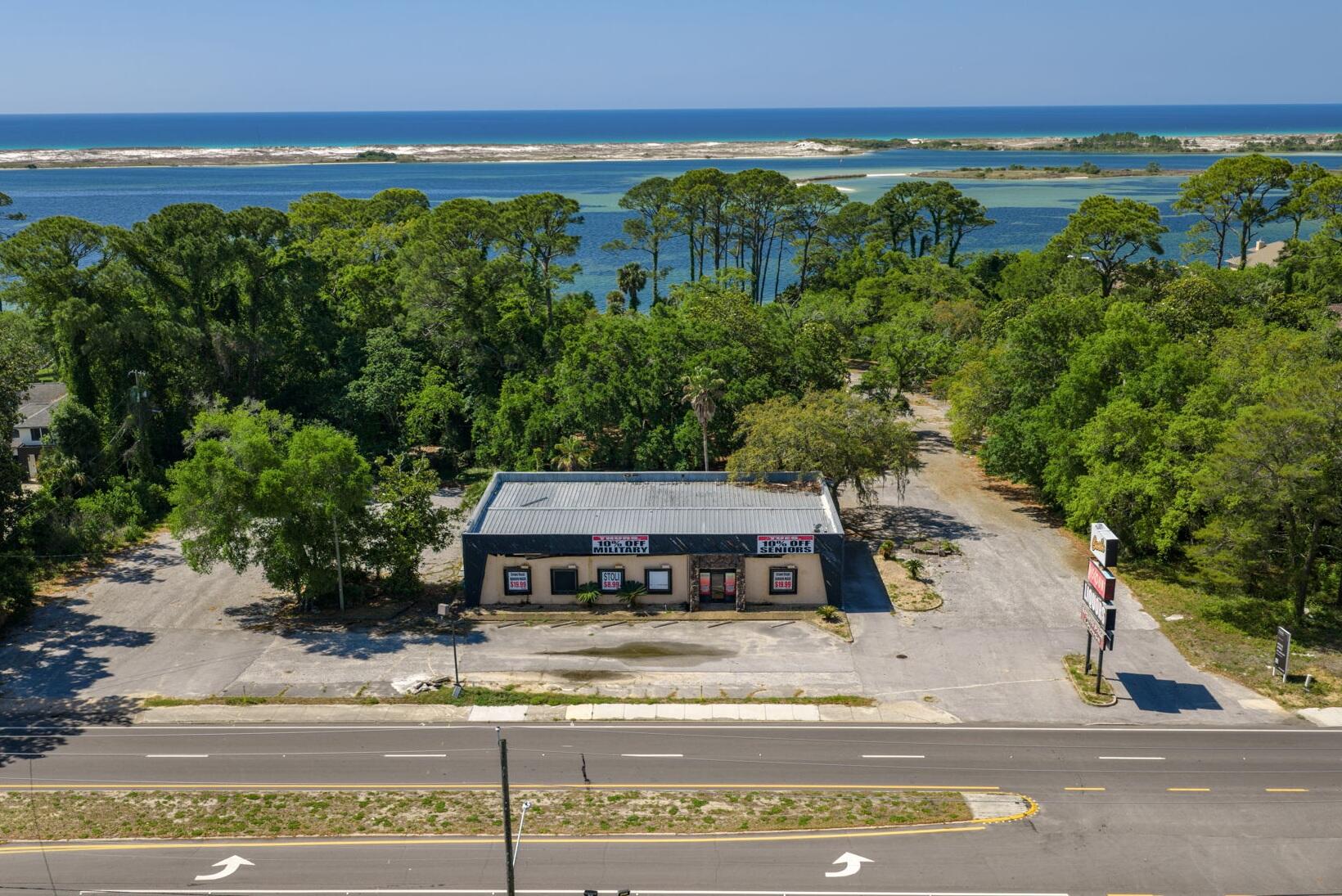 Positioned along Highway 98 with direct frontage and an AADT of 27,000 vehicles, this 4,000 SF retail building sits on a generous 5.03-acre parcel in one of Mary Esther's most active commercial corridors. Offered For Sale at $4,995,000, the property delivers exceptional visibility, strong traffic flow, and rare scale for this stretch of the Miracle Strip Parkway.

Supporting robust year-round demand from both local residents and the steady flow of commuters between Fort Walton Beach, Hurlburt Field, and Navarre. With its expansive acreage, prominent frontage, and flexible retail positioning, the site is well-suited for operators or investors seeking a high-impact location in a tightly held Gulf Coast market. This property represents a standout opportunity to secure significant land, frontage, and long-term commercial potential along one of Northwest Florida's most traveled coastal corridors.