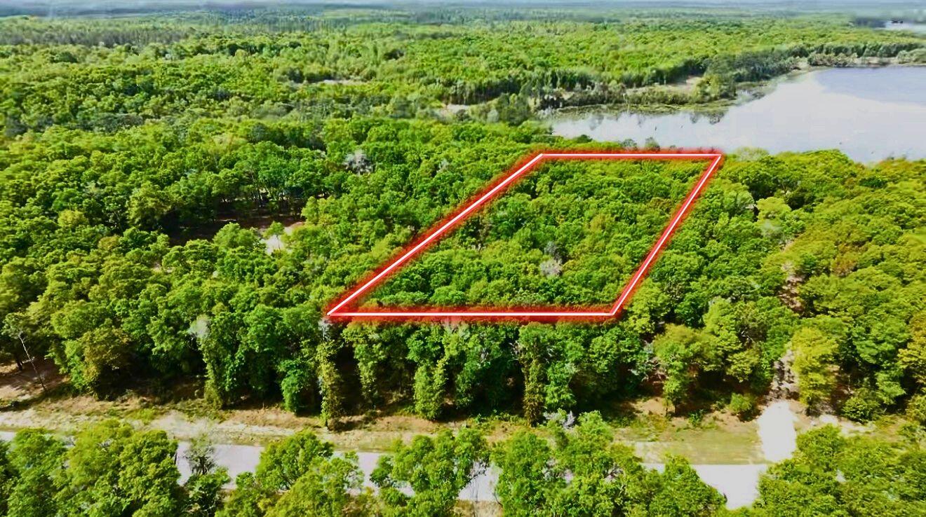 Own your piece of lakefront Florida in the private community of Seacoast Estates. This nearly 1-acre homesite offers approximately 76 feet of direct frontage on a spring-fed lake, with over 500 feet of depth providing exceptional privacy and flexibility for your future build. 
Position to capture peaceful water views and natural surroundings, this lot is ideal for a primary residence, second home, or investment retreat. Utilities including water and electric are already available, making it easier to bring your vision to life. 
Enjoy access to multiple lakes known for great fishing, all within a quiet, well maintained community just minutes from historic DeFuniak Springs. Experience small-town charm while being only about 30 miles from the white sand beaches of the Emerald Coast. **CONCEPTUAL RENDERINGS ADDED. Images are AI-generated and provided solely to illustrate potential development possibilities. Home, improvements, landscaping, pool, dock, furnishing views and other features depicted are not existing and are not included in the sale. No representation is made that the depicted design can be constructed or permitted on this property. Buyer to independently verify all building requirements, setback, permitting, utilities, dock eligibility and development feasibility.
