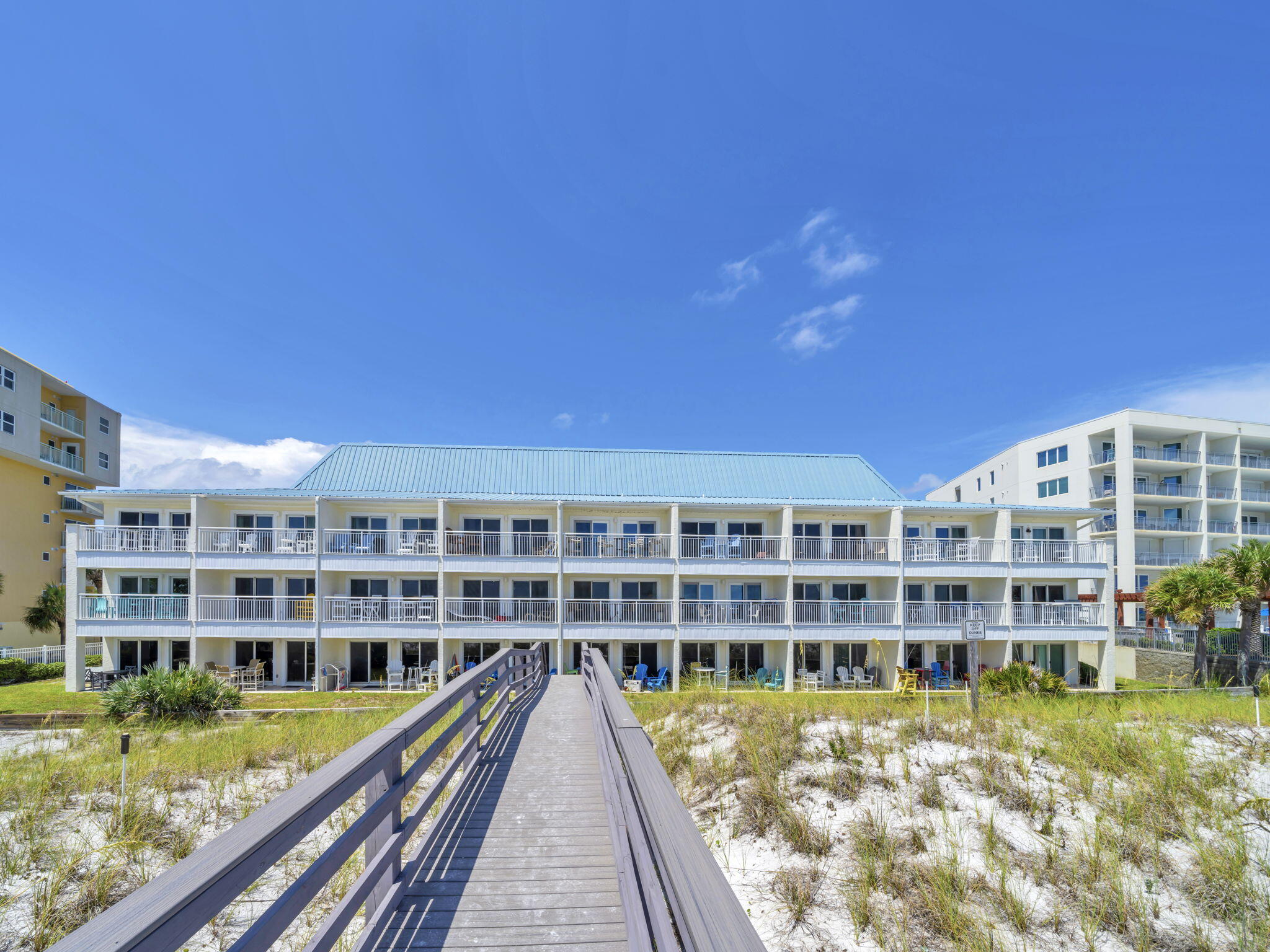 Beachfront Bargain with Proven Rental Income! Looking for an affordable way to own Gulf-front property on the Emerald Coast? Island Sands 104 offers the perfect combination of beachfront living and investment ROI with great rental income year after year. 
Forget the crowds, elevators, and parking headaches. This ground-floor Gulf-front condo is located in a charming 27-unit low-density community on Okaloosa Island, allowing you to park just outside your door and step directly from your private patio onto the boardwalk leading to the sugar-white sand and emerald waters.
Beautifully maintained and move-in ready, the condo features bright coastal décor, updated bathrooms, fresh paint, newer furnishings, and updated appliances. Enjoy watching the kids play in the grassy area outside your patio while you relax to the sound of the waves.
Island Sands is a low density beach resort offering a community pool, grilling area, and direct beach access.  Extensive recent property improvements have all been paid for, and this little beach community is turning heads!   Conveniently located near dining, shopping, entertainment, and local attractions, this low-density beachfront retreat is a favorite among both owners and vacation guests. 
Whether you're looking for a personal beach getaway, an income-producing investment, or both, Island Sands 104 is a rare opportunity to own Gulf-front property at an exceptional value. Schedule your private showing today