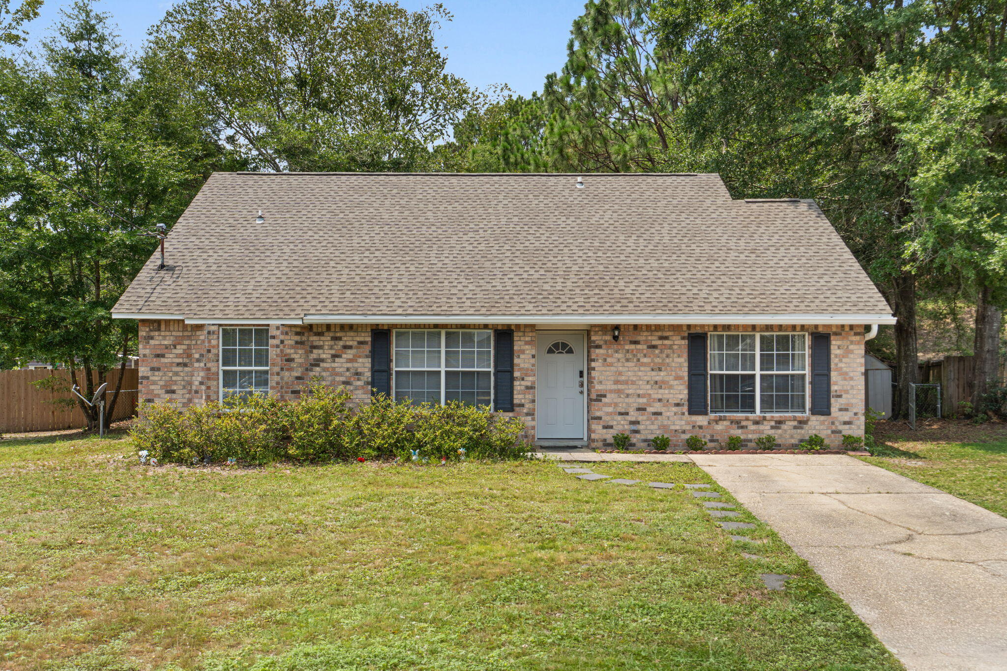 Welcome to 127 Oak Terrace! Situated on a spacious 0.35-acre lot, this 4-bedroom, 2-bath home offers the space, comfort, and updates you've been searching for. Conveniently located just south of I-10, you'll enjoy easy access to grocery stores, schools, and nearby military bases.

Step inside to find a welcoming living room with modern finishes that continue into the updated kitchen, featuring granite countertops, stylish cabinetry, a tile backsplash, and stainless steel appliances.

The home offers three generously sized bedrooms on the main level, while the private primary suite upstairs provides a quiet retreat away from the rest of the home.

Out back, the fully fenced backyard offers plenty of room for entertaining, pets, play, or creating your own outdoor oasis. Don't miss the opportunity to make this move-in-ready home yours!

VA Assumable 4.25%