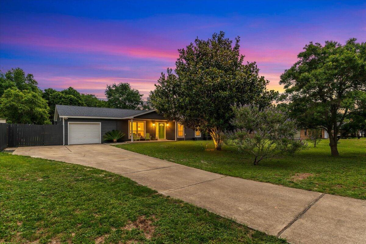 Welcome home to this lovingly maintained 4-bedroom, 2-bathroom residence that perfectly blends comfort, functionality, and timeless style. From the moment you step inside, you'll appreciate the fresh paint, new carpeting, and bright, welcoming atmosphere throughout.

The heart of the home is the spacious kitchen, which opens seamlessly to the main living area, creating the ideal space for gathering with family and friends. Both bathrooms have been thoughtfully updated with timeless finishes that offer lasting appeal and everyday comfort.

One of the home's standout features is the incredible Florida room--an inviting extension of the living space that's perfect for morning coffee, entertaining guests, or simply relaxing while enjoying views of the expansive backyard. With plenty of room to play, garden, or create your own outdoor oasis, the possibilities are endless.

Additional highlights include a newer roof, a one-car garage, and the freedom of no HOA restrictions. Conveniently located just minutes from Hurlburt Field, shopping, dining, and beautiful Emerald Coast beaches, this move-in ready home offers the perfect combination of location, charm, and value.

Don't miss your opportunity to make this special property your own!