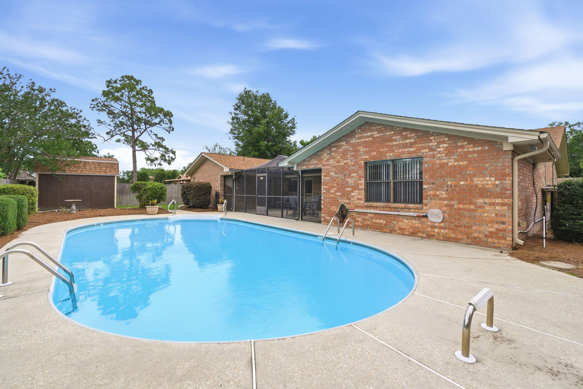 From the moment you arrive, you'll appreciate the care and pride of ownership reflected throughout this well-maintained brick pool home offering nearly 2,900 square feet of living space. Mature landscaping, refreshed planting beds, and inviting curb appeal create a welcoming first impression before you even step inside.

Inside, warm wood beams, a striking brick accent wall, and custom built-ins create character and charm that are difficult to find in today's homes. The spacious bedrooms offer room to spread out, while the thoughtful floor plan provides comfortable everyday living. An oversized laundry room and a kitchen featuring two ovens add to the home's functionality for both everyday living and entertaining.

Perhaps the home's most unique feature is the versatile bonus area, formerly the garage, complete with extensive cabinetry, a sink, refrigerator, microwave area, and two built-in workstations. Whether you envision a home office, hobby space, study area, craft room, game room, workout area, or simply incredible storage, this flexible space offers exceptional versatility.

Step outside to your own private backyard retreat featuring a screened patio, in-ground pool, privacy fencing, and a storage building perfect for lawn equipment, pool supplies, and additional storage. Whether entertaining guests or simply enjoying a quiet evening outdoors, this inviting space is designed to be enjoyed throughout the year.

Recent updates provide added peace of mind, including a roof replaced in 2022, both HVAC systems replaced in 2021, a water heater replaced in 2026, new carpet installed in 2026, and fresh interior paint throughout. Combining character, thoughtful updates, generous living space, and a versatile layout, this home is ready for its next owner.

Inside, warm wood beams, a striking brick accent wall, and custom built-ins create character and charm that are difficult to find in today's homes. The spacious bedrooms offer room to spread out, while the thoughtful floor plan provides flexibility for a variety of lifestyles. An oversized laundry room and a kitchen featuring two ovens add to the home's functionality for both everyday living and entertaining.

Perhaps the home's most unique feature is the converted garage space, complete with extensive cabinetry, a sink, refrigerator, microwave area, and two built-in workstations. Whether you envision a home office, hobby space, study area, craft room, game room, or simply incredible storage, this versatile area offers endless possibilities.

Step outside to your own private backyard retreat featuring a screened patio, in-ground pool, privacy fencing, and a storage building perfect for lawn equipment, pool supplies, and additional storage. Whether hosting family and friends or simply enjoying a quiet evening at home, this outdoor space is designed to be enjoyed year-round.

Recent updates provide peace of mind, including a roof replaced in 2022, both HVAC systems replaced in 2021, water heater replaced in 2026, new carpet installed 2026 and fresh interior paint throughout. If you're looking for a home with character, functionality, and flexible spaces that adapt to today's lifestyles, this one is a must-see.