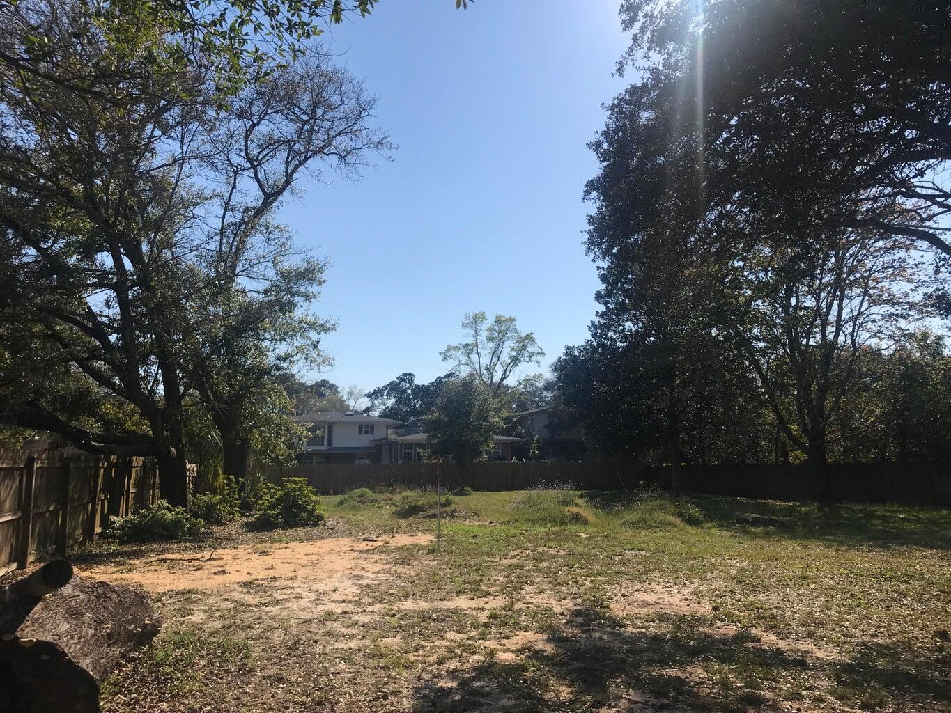 Awesome opportunity! Vacant lot in the heart of Fort Walton Beach! Privacy fence around three sides of lot. Level lot to build your New home. Mature trees around the edges of the property. NO HOA. Located across the street from Cinco Bayou. There aren't may lots this size left in Fort Walton Beach so don't hesitate on this one!