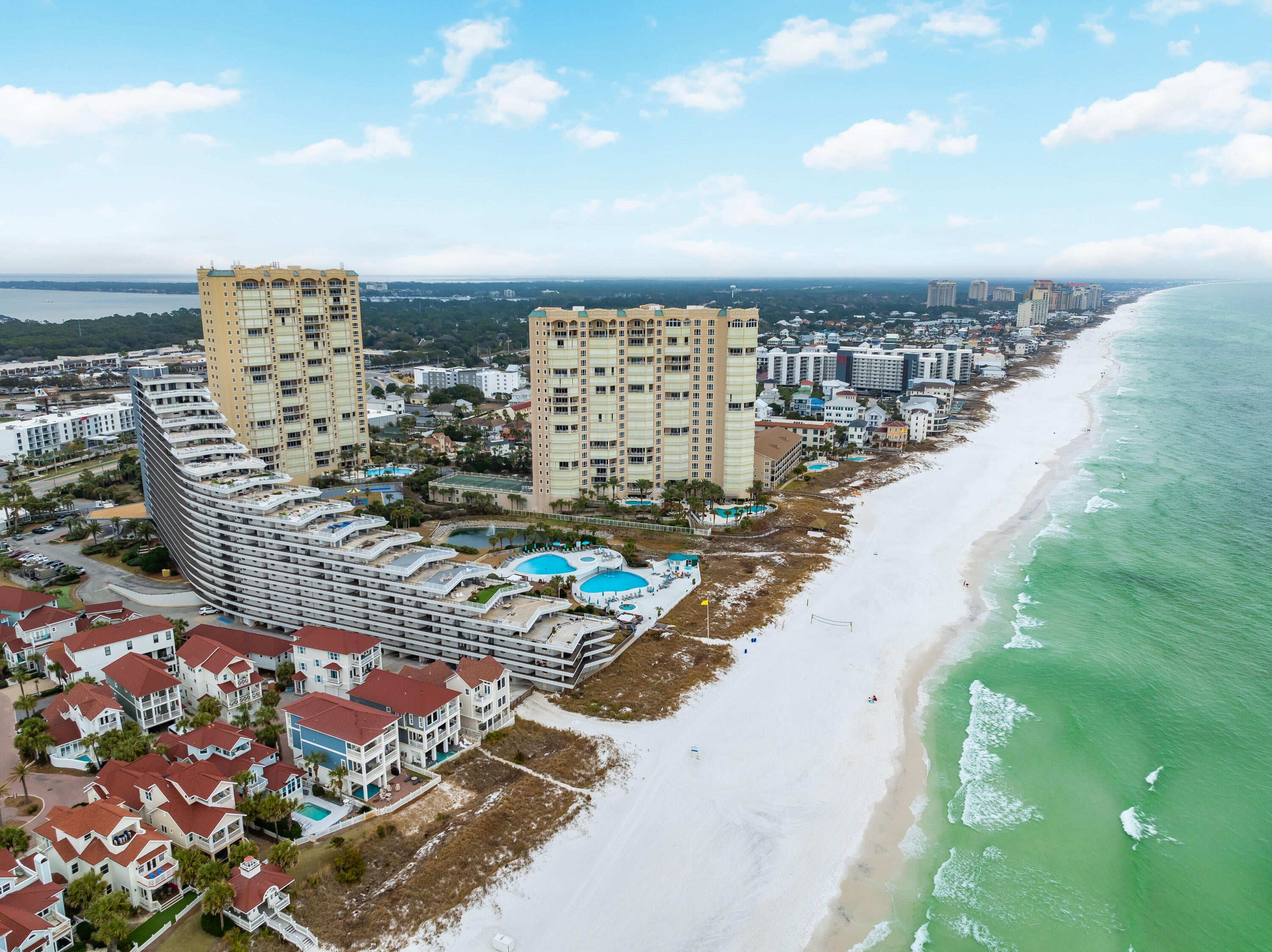 LOWEST PRICE 1 BEDROOM UNIT AVAILABLE IN EDGEWATER! This unit blends comfort & convenience with coastal living! A great opportunity for an investment, second home, or primary residence. Stepping inside you'll find an open floor concept seamlessly connecting the Kitchen, Dining Area and Living Room. Floor to Ceiling sliding doors from the Living Room take you from your cozy abode to a covered patio and direct access to the beach! Right from your very one patio! 
The kitchen hosts soft-close cabinets & drawers, breakfast bar, modern stainless steel appliances, dimmable lighting, and ample storage to stash kitchen necessities like dishware and beach snacks. In-unit washer and dryer adds to your easy beach living lifestyle. The spacious living room offers owners and guests a walk-out patio, offering direct access to the community's Resort-Style Amenities including Multiple Pools, Playground, approximately 425' of Gulf Coast Beach! The gated entrance to the complex and ample covered parking offer addeed security piece of mind for owners and their guests. With it's central location, the complex is located only 4 minutes from the Shopping, Entertainment, and Dining of the Silver Sands Premium Outlets, just 20 minutes from Destin's bussling Harbor and 30 Minutes from the iconic beach towns of 30A.