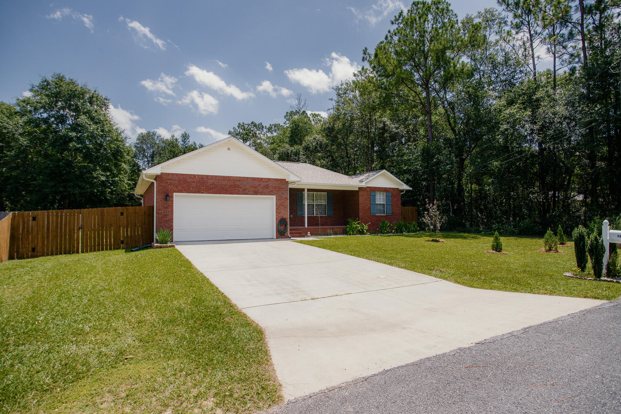 Attention Whiting Field!!!Welcome home to this charming and beautifully maintained 3 bedroom/2 bath split floor plan home.   Home is ideally situated in a peaceful country setting just about 30 minutes from the beautiful Gulf Coast beaches.  Conveniently located near Whiting Field , this property offers the tranquility of country living while keeping shopping and dining within easy reach.  Major improvements include:  A NEW ROOF IN 2022, HVAC IN 2019, WATER HEATER 2023, GUTTERS 2023 AND FRESHLY PAINTED INTERIOR 2026.   THE KITCHEN HAS ALSO BEEN REFRESHED WITH A WHIRLPOOL STOVE AND REFRIGERATOR IN 2026. WHILE THE WASHER/DRYER AND DISHWASHER WERE REPLACED IN 2022. An attic for extra storage.  Septic tank has been pumped and inspected in July 2026.
Outside is the beautiful flat yard which is perfect for a garden.  Plus, you'll appreciate the 8'  double gates to pull in a  boat or RV.  
This is an amazing all brick house which would make a wonderful home!! Don't miss your opportunity to own it!!!