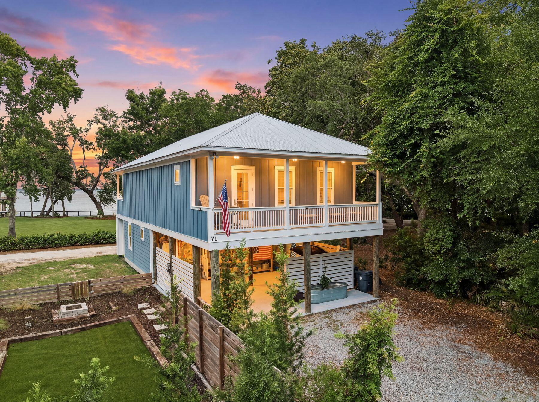Sweeping views of Choctawhatchee Bay, peaceful surroundings and easy access to the white-sand beaches of 30A create an exceptional setting for this thoughtfully updated Magnolia Beach residence in the highly sought-after Point Washington area. Framed by mature oaks and positioned to capture unforgettable sunsets, this three-bedroom, two-and-a-half-bath home offers a relaxed coastal lifestyle with inviting indoor and outdoor living spaces. Spanning approximately 2,416 square feet, the well-designed floor plan places two guest bedrooms, a full bath and laundry area on the first living level, while the upper floor opens into a light-filled great room beneath vaulted ceilings. Luxury vinyl plank flooring, quartz countertops and stainless steel appliances complement the kitchen, while expansive windows draw in natural light and showcase the bay views beyond. The spacious primary suite provides a peaceful retreat, while a second south-facing balcony offers a quiet place to enjoy the sounds of nature beneath the canopy of surrounding trees. Since purchase, the home has been thoughtfully enhanced with approximately 270 square feet of additional downstairs living space, new flooring, an updated master bathtub, refreshed countertops, a new kitchen sink and dishwasher, updated ceiling fans throughout and a Culligan water filtration system, providing added comfort and convenience for years to come. Covered parking and generous outdoor living areas create additional space to gather, unwind or store beach gear after a day along the coast. With Choctawhatchee Bay just outside your window and the renowned beaches, dining and attractions of 30A only minutes away, this home offers an outstanding opportunity for full-time living or a coastal getaway in one of Point Washington's most desirable locations