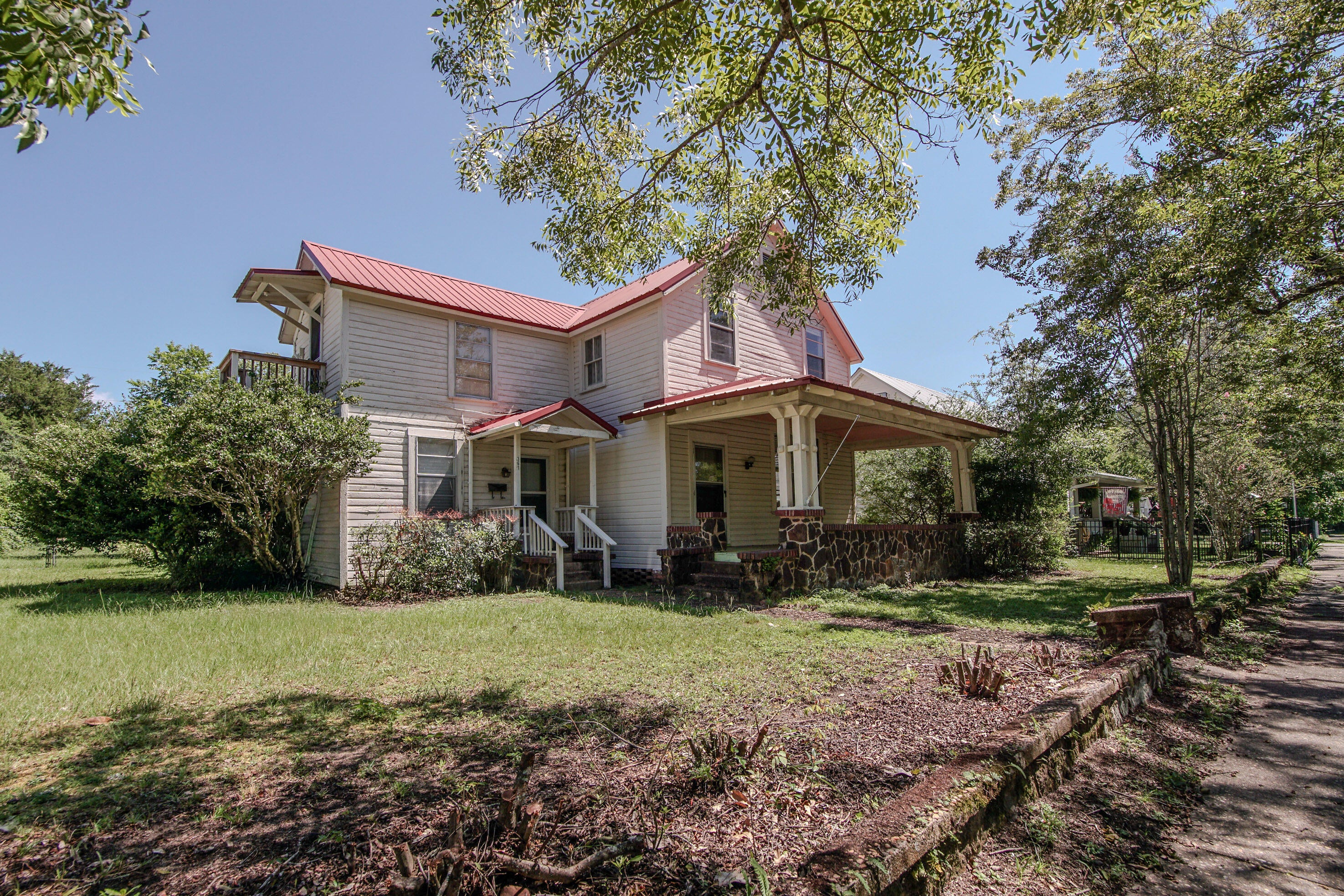 This home offers flexibility you just don't find every day, especially in the historic district. This 2,160 SF, two-story home has a proven layout for multi-use living, income potential, or both. With 4 bedrooms and 2.5 baths, the home is currently configured as two separate living spaces. Downstairs is 3 beds/2 bath, and upstairs is a 1 Bed/1 Bath (with 5th bed potential), plus a 2nd kitchen. Live on one level and rent the other, create a multi-generational setup, or explore a duplex conversion and rent both floors. The home sits on a generous 1/3-acre lot with a fenced backyard,. It's just minutes to downtown DeFuniak Springs, Lake DeFuniak, Walton Middle, and quick access to Hwy 331 South. Conventional financing or cash only please!