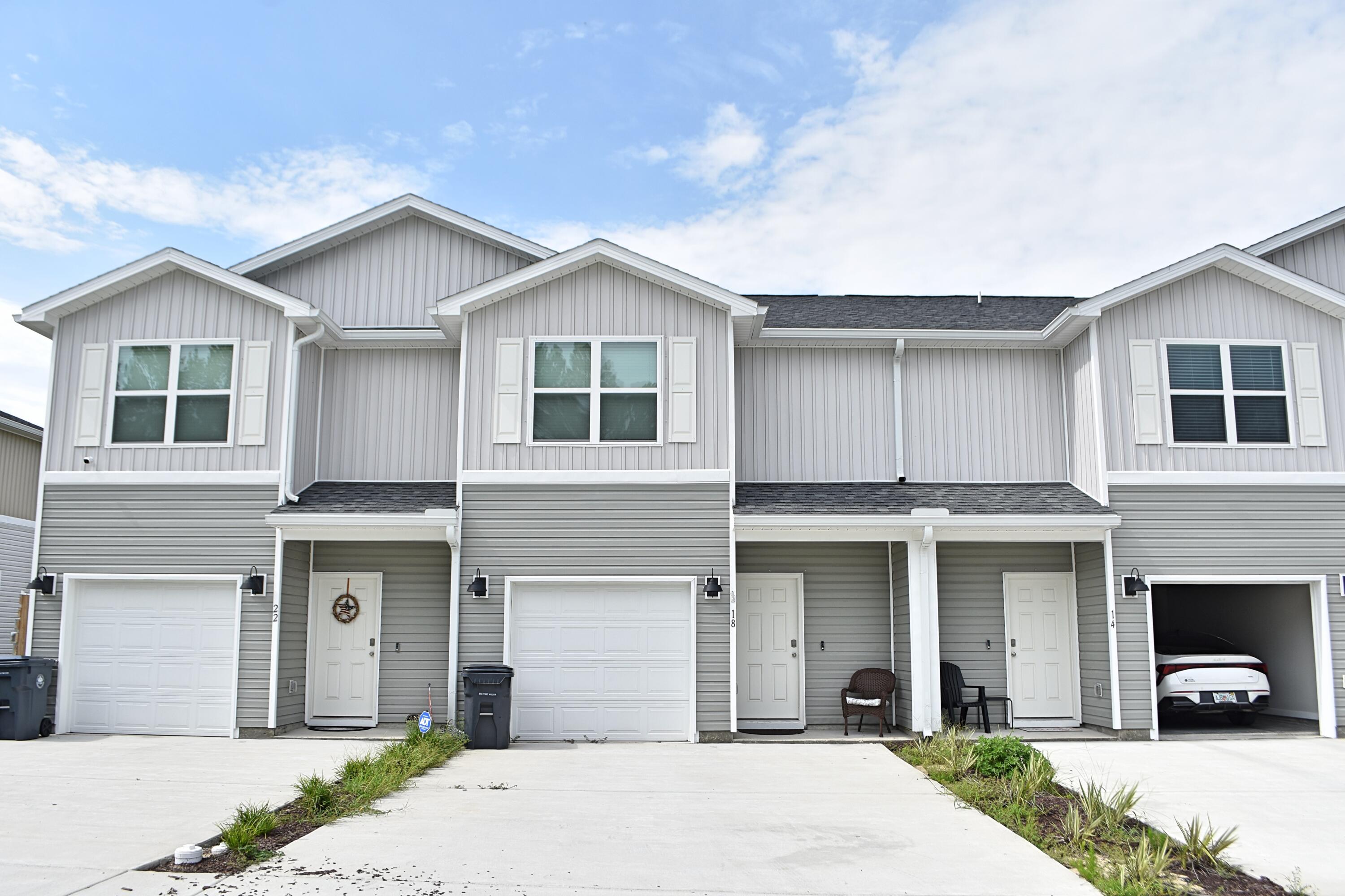 Welcome to 18 Rudder Lane, an interior townhome in the sought-after Genoa Landing community in Freeport. Step inside to durable EVP flooring that flows through an open-concept kitchen, living, and dining space, ideal for entertaining and everyday living alike. The dining area opens to a private back patio, while a large window fills the space with natural light. The kitchen anchors it all with a spacious center island, abundant cabinetry, quartz countertops, and stainless steel appliances. Upstairs, the primary suite offers a generous walk-in closet and a private bath with dual-sink vanity and ample linen storage, while two additional bedrooms share a full hall bath -- ideal for roommates or family. With a one-car garage and easy access to Highway 20, this brand-new 2025 build is move-in ready. No pets, please.